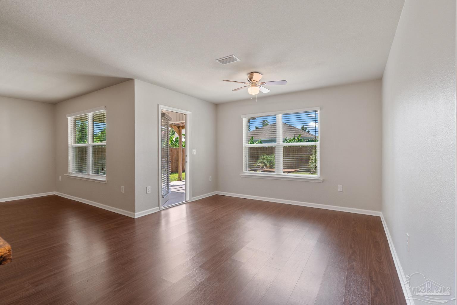 17438 Harding Drive Foley, AL 36535 - Photo 24 of 56 a view of an empty room with wooden floor and a window