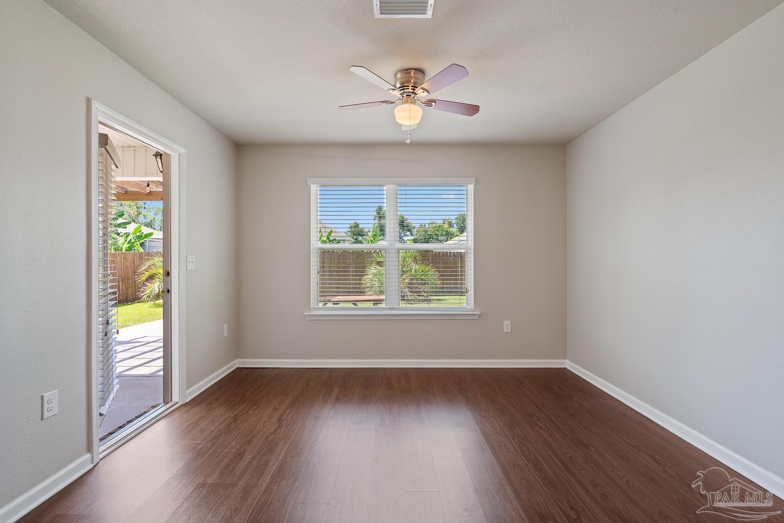 17438 Harding Drive Foley, AL 36535 - Photo 25 of 56 a view of an empty room with wooden floor and a window