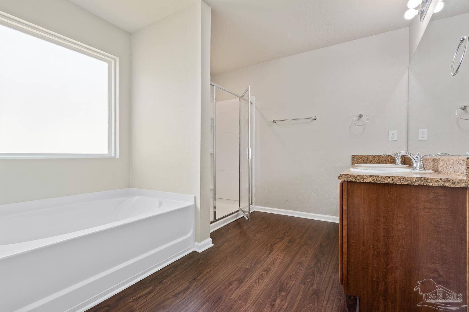 17438 Harding Drive Foley, AL 36535 - Photo 31 of 56 a bathroom with a bathtub and a sink