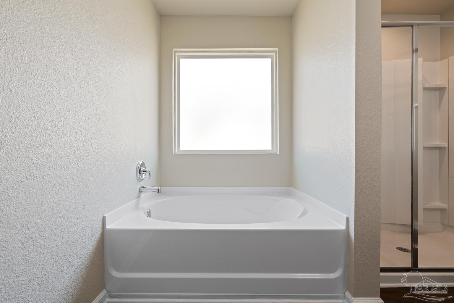 17438 Harding Drive Foley, AL 36535 - Photo 32 of 56 a white bath tub sitting next to a window
