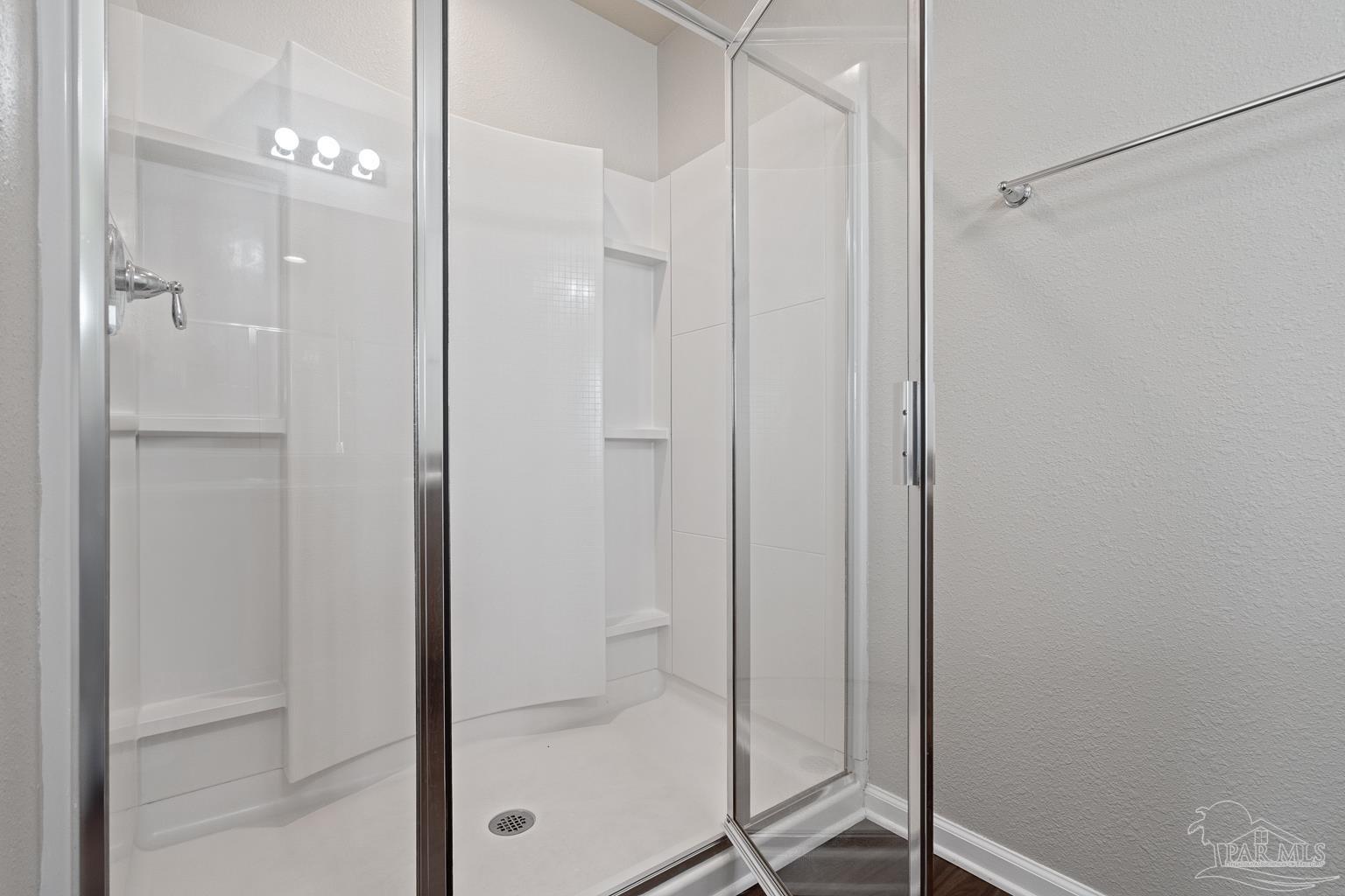 17438 Harding Drive Foley, AL 36535 - Photo 33 of 56 a bathroom with a glass shower door and a shower