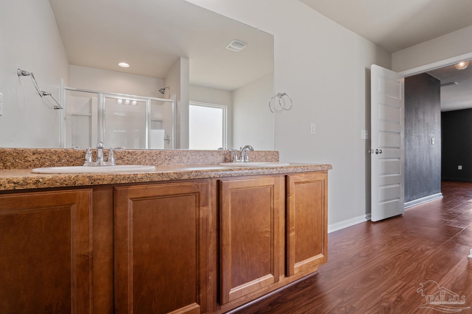 17438 Harding Drive Foley, AL 36535 - Photo 35 of 56 a bathroom with a granite countertop sink and a mirror