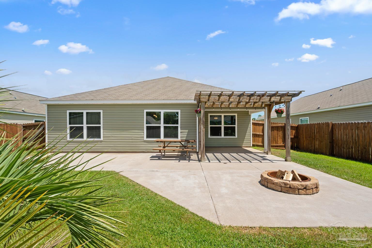 17438 Harding Drive Foley, AL 36535 - Photo 40 of 56 a view of a house with backyard sitting area and porch