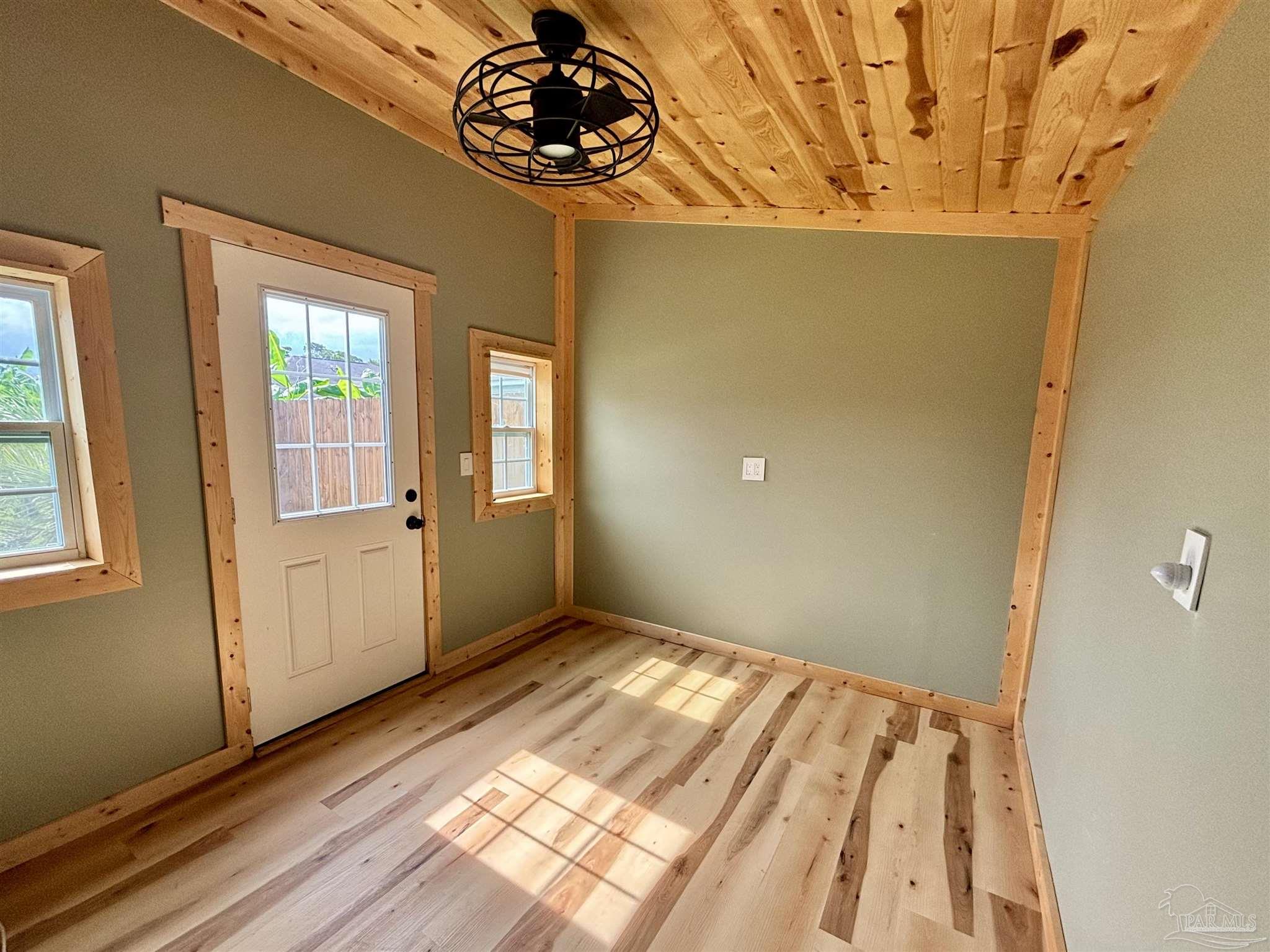 17438 Harding Drive Foley, AL 36535 - Photo 45 of 56 a view of an empty room with wooden floor and a window