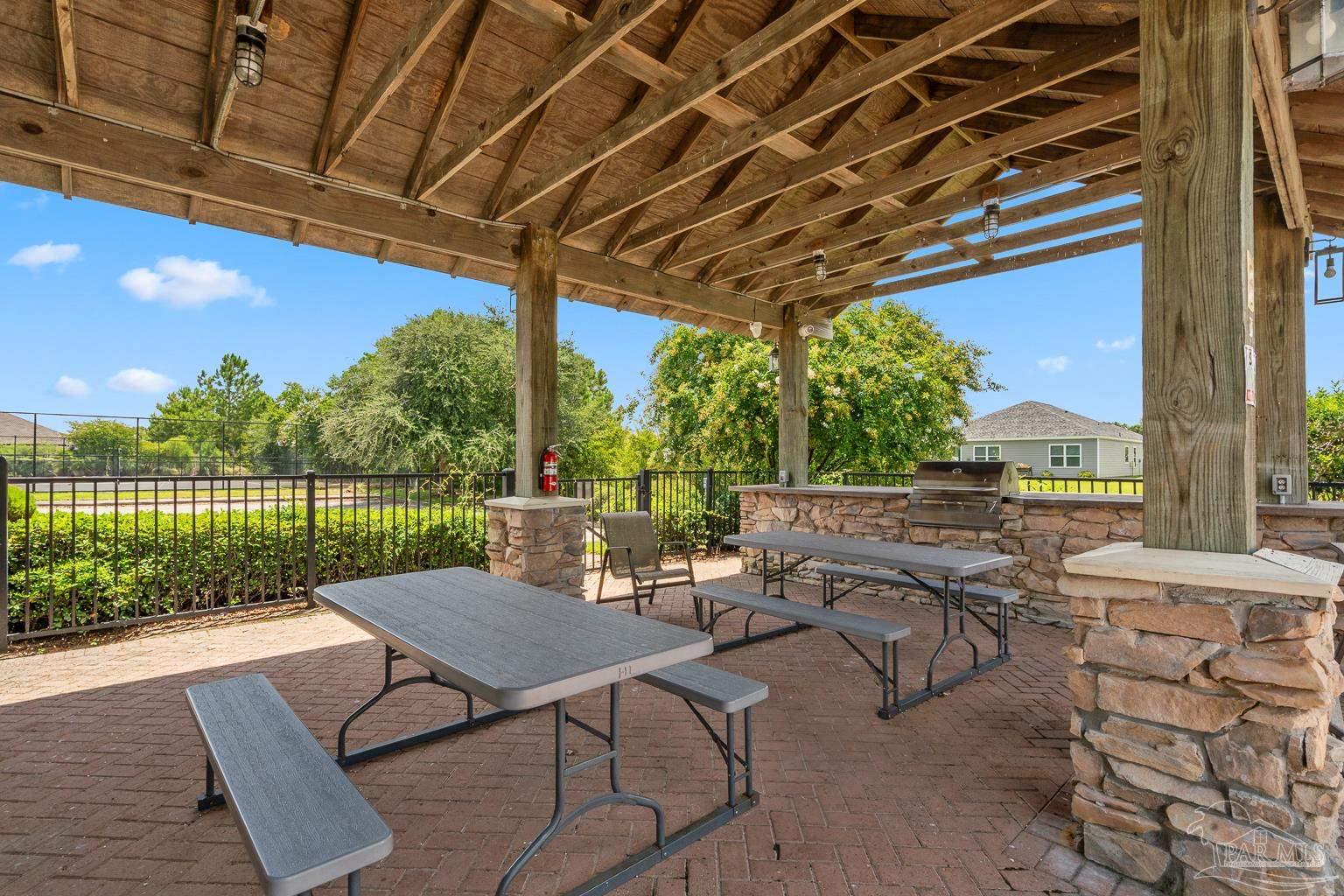 17438 Harding Drive Foley, AL 36535 - Photo 54 of 56 a view of a patio with a table and chairs