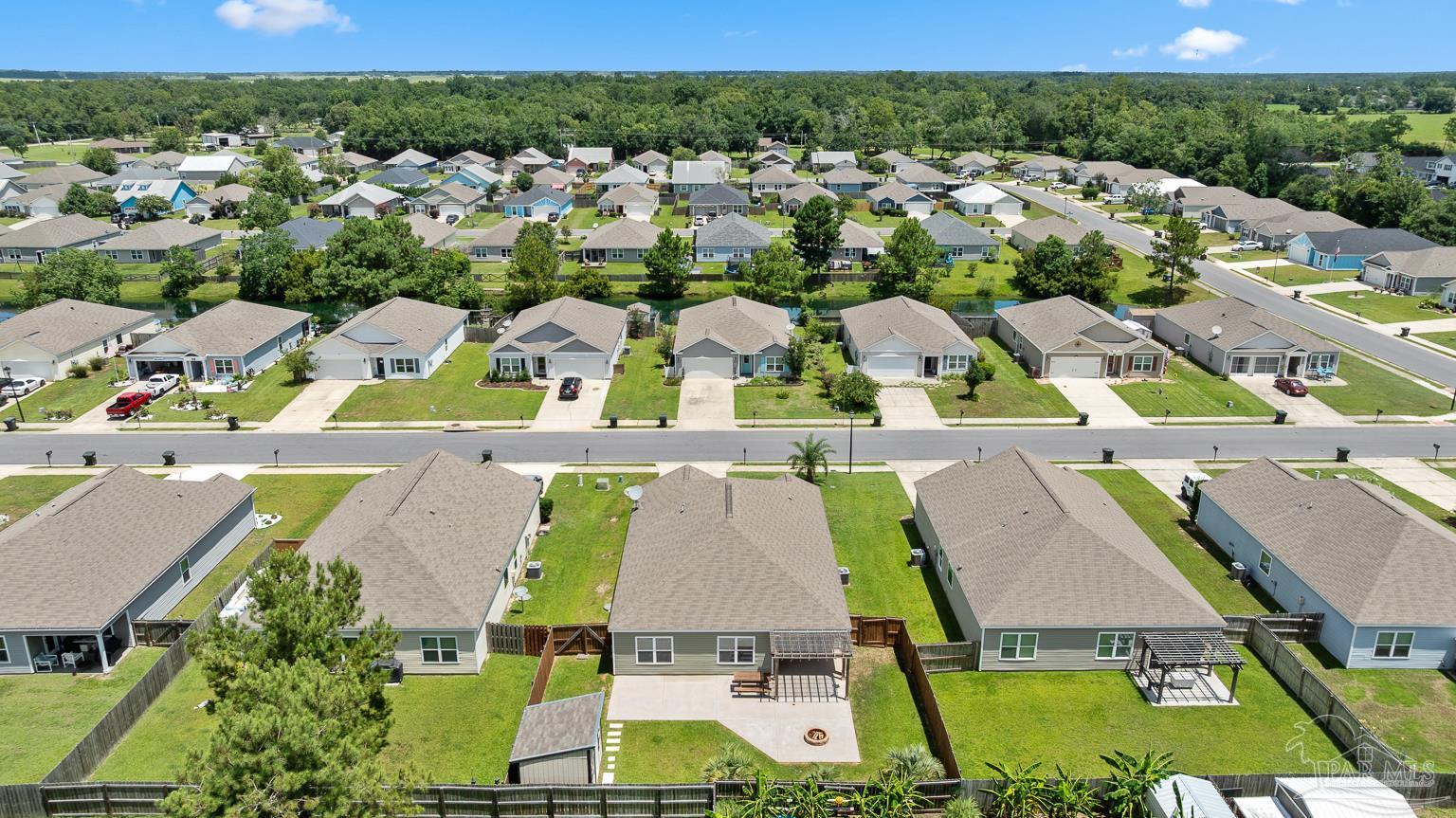 17438 Harding Drive Foley, AL 36535 - Photo 55 of 56 an aerial view of residential houses with outdoor space and parking