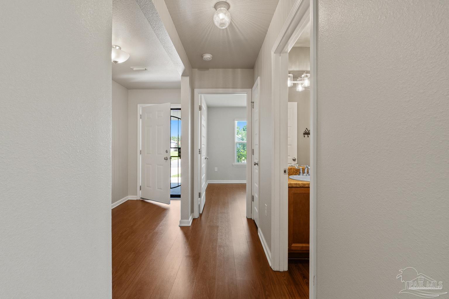 17438 Harding Drive Foley, AL 36535 - Photo 7 of 56 a view of a hallway with wooden floor