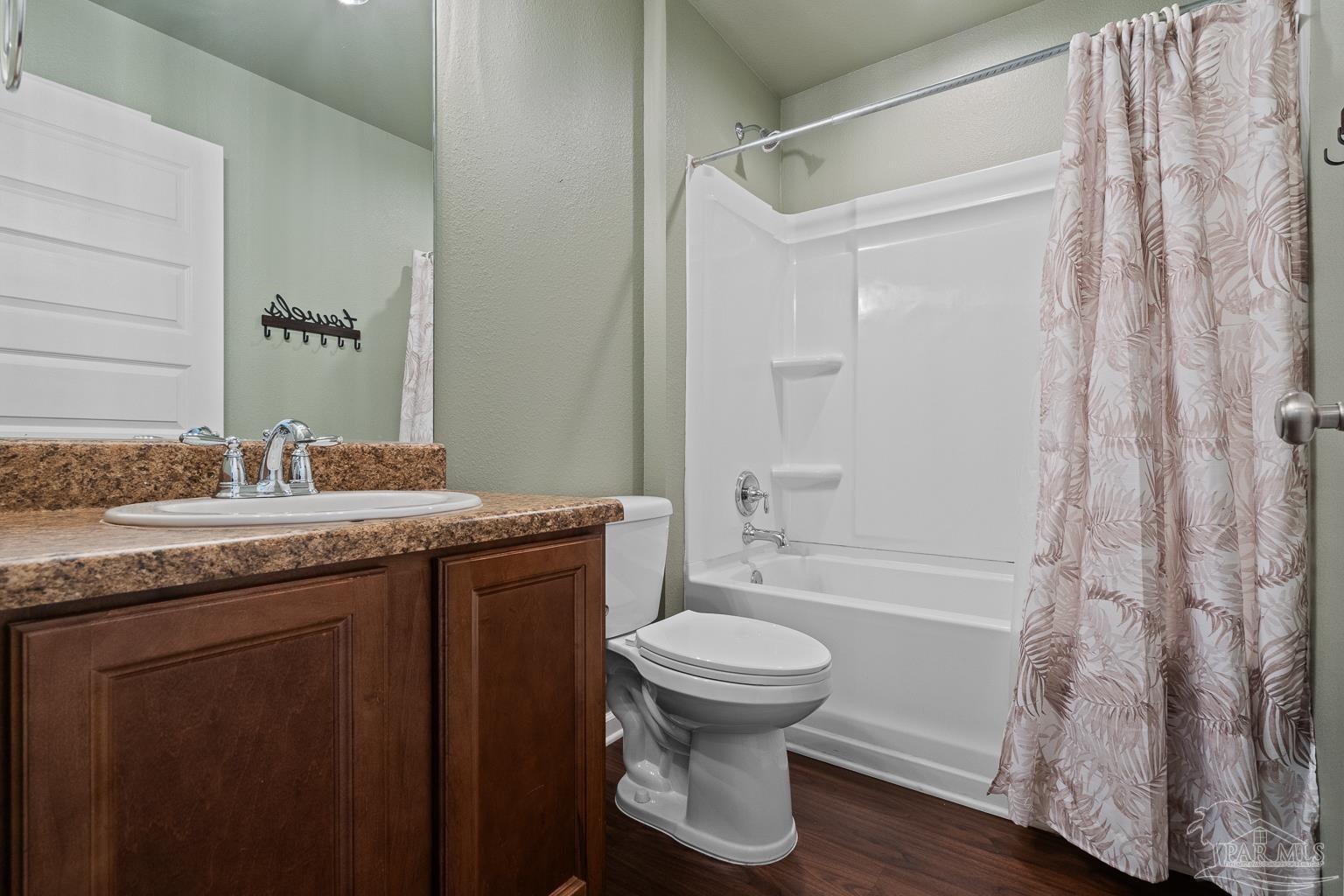 17438 Harding Drive Foley, AL 36535 - Photo 9 of 56 a bathroom with a granite countertop sink toilet and shower