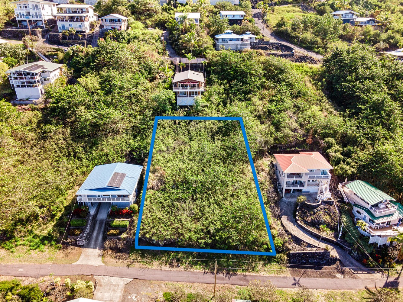 146 Fern Road Captain Cook, HI 96704 - Photo 2 of 9 an aerial view of a house with a yard and garden