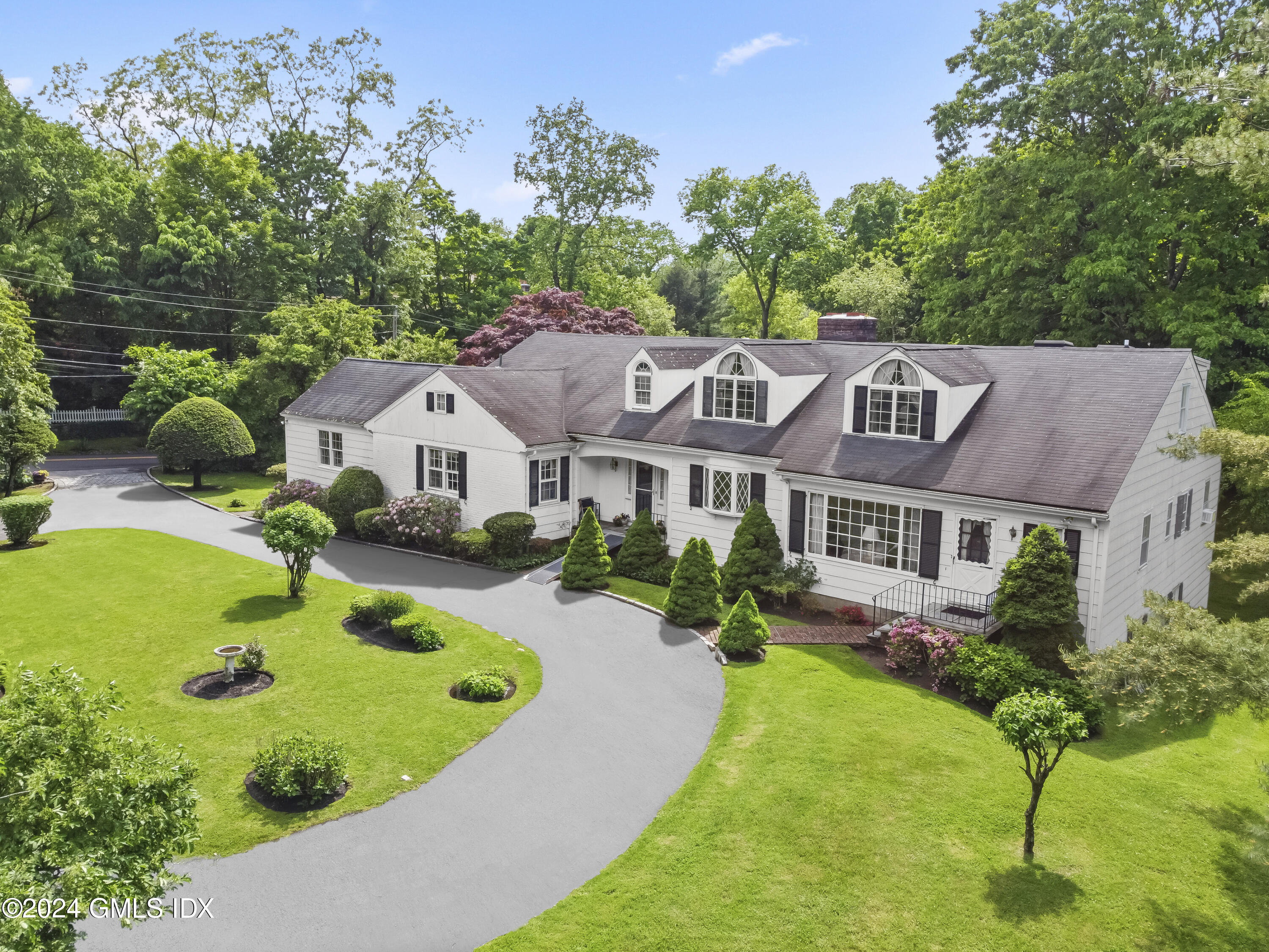 34 Hill Road Greenwich, CT 06830 - Photo 1 of 22 a aerial view of a house with swimming pool garden and patio