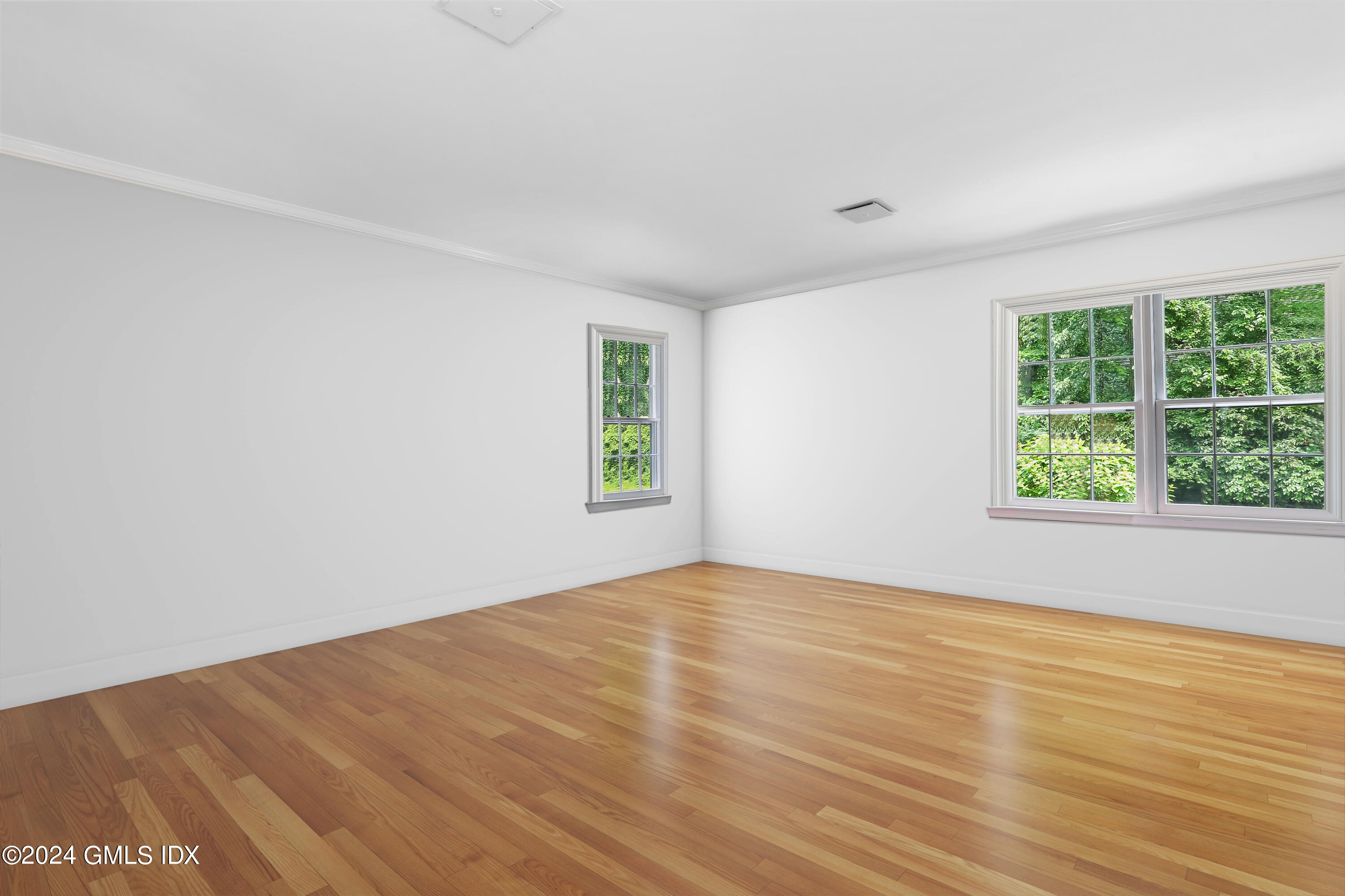 34 Hill Road Greenwich, CT 06830 - Photo 11 of 22 wooden floor in an empty room with a window