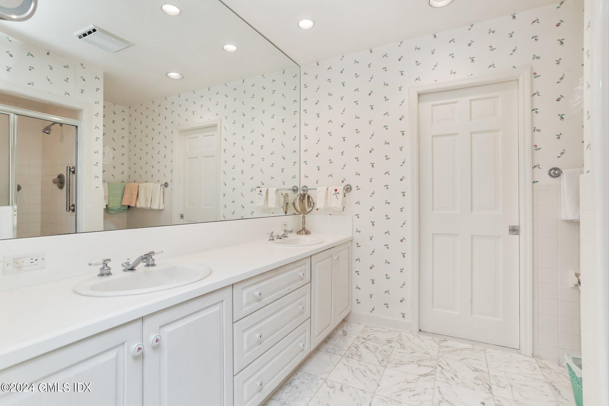 34 Hill Road Greenwich, CT 06830 - Photo 12 of 22 a bathroom with a sink double vanity and a shower