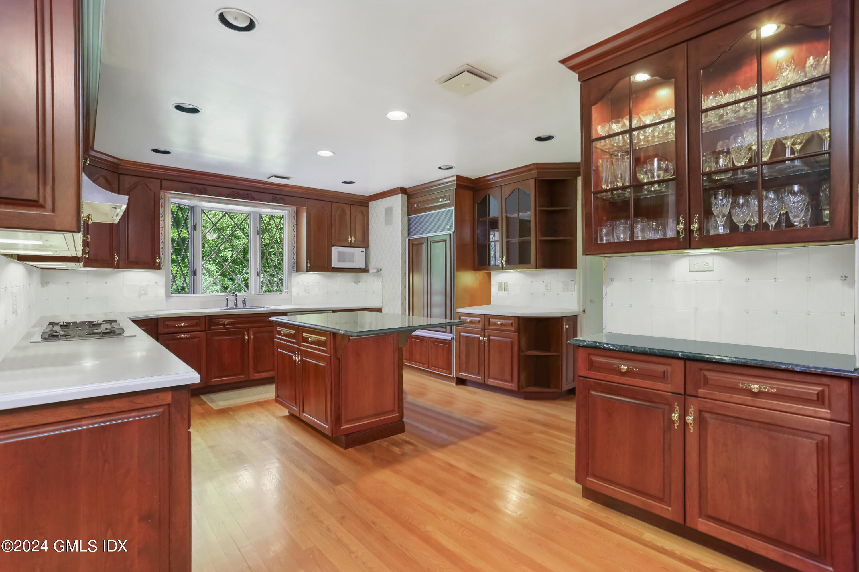 34 Hill Road Greenwich, CT 06830 - Photo 6 of 22 a kitchen with stainless steel appliances granite countertop wooden cabinets a stove and a sink