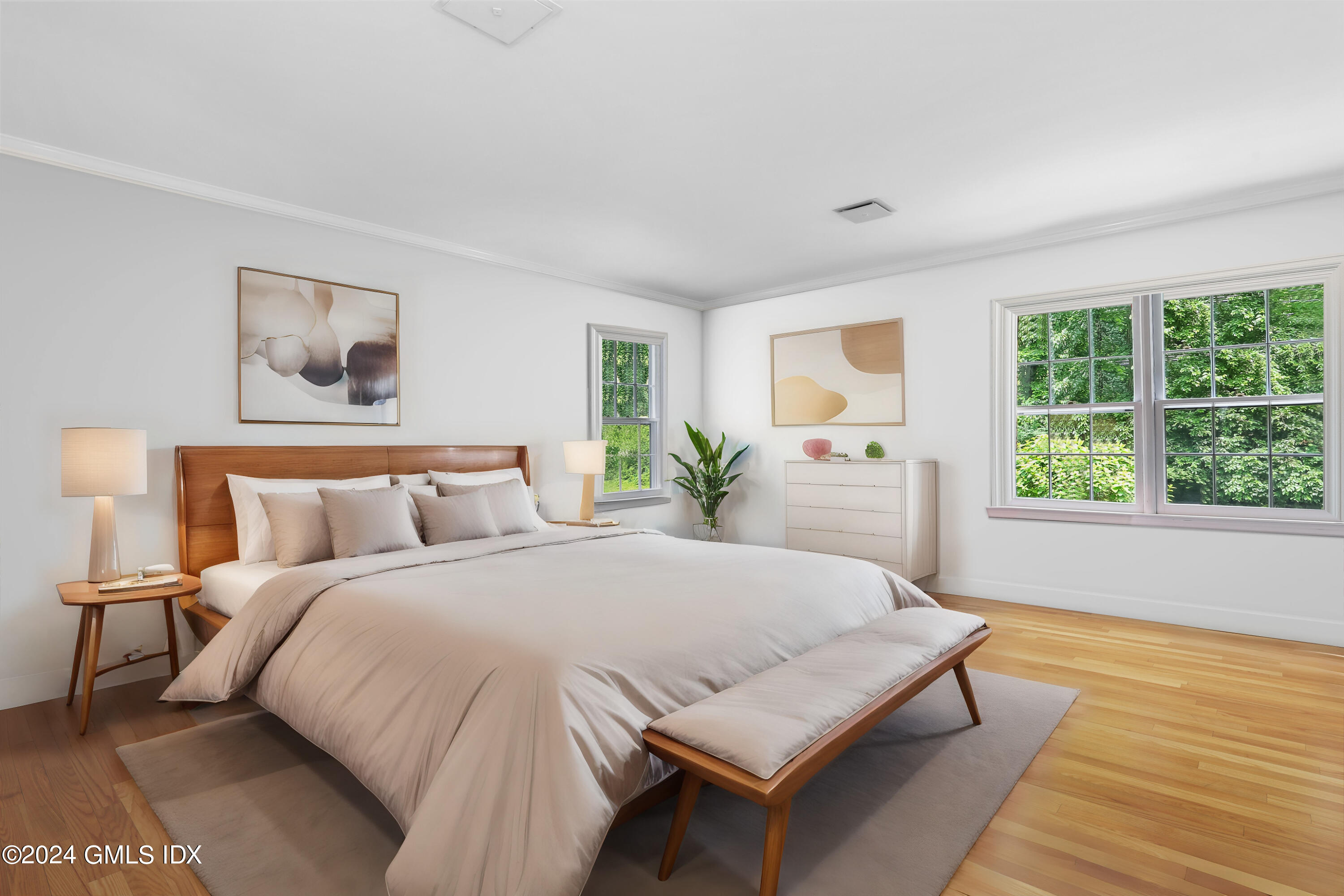 34 Hill Road Greenwich, CT 06830 - Photo 10 of 22 a spacious bedroom with a bed and a large window