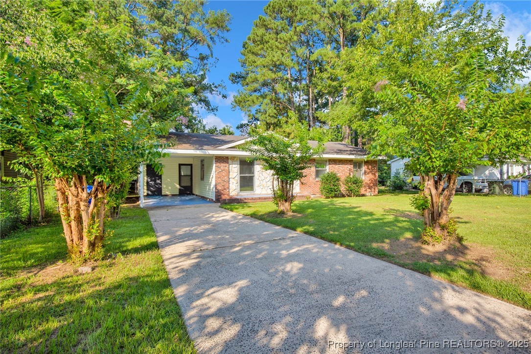 417 Perth Street Fayetteville, NC 28314 - Photo 2 of 30 a front view of a house with a yard and trees