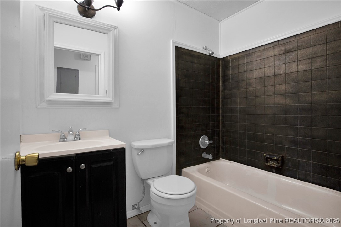 417 Perth Street Fayetteville, NC 28314 - Photo 21 of 30 a bathroom with a sink a toilet and mirror