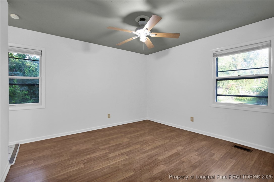 417 Perth Street Fayetteville, NC 28314 - Photo 22 of 30 a view of an empty room with wooden floor and a window