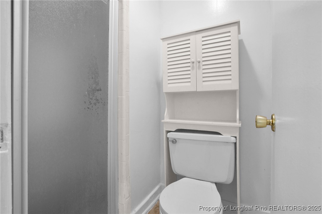 417 Perth Street Fayetteville, NC 28314 - Photo 25 of 30 a bathroom with a toilet and a window