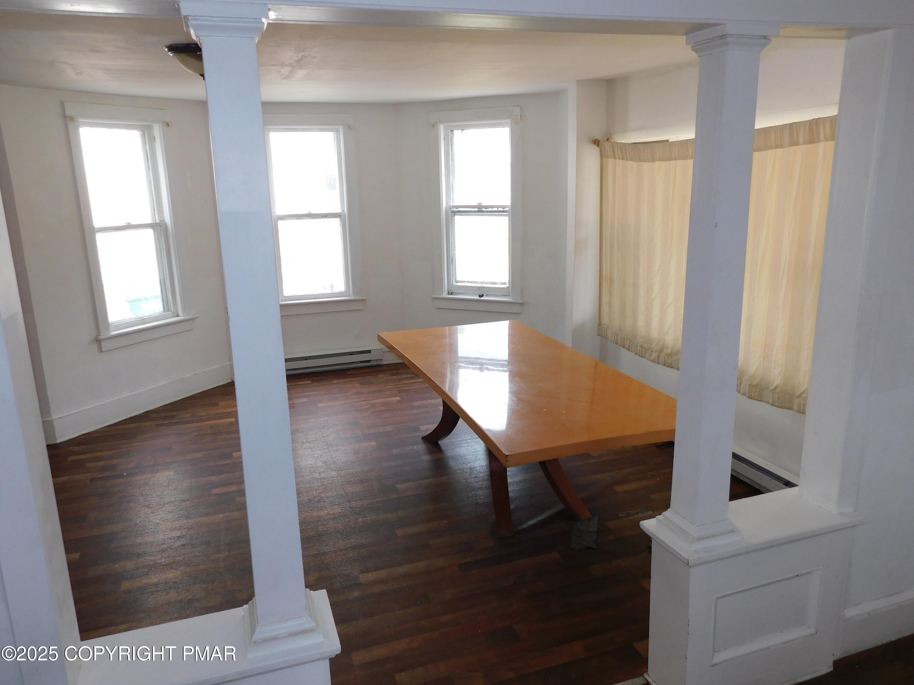 112 Ridgeway Street East Stroudsburg, PA 18301 - Photo 16 of 39 a view of a hallway with wooden floor and staircase