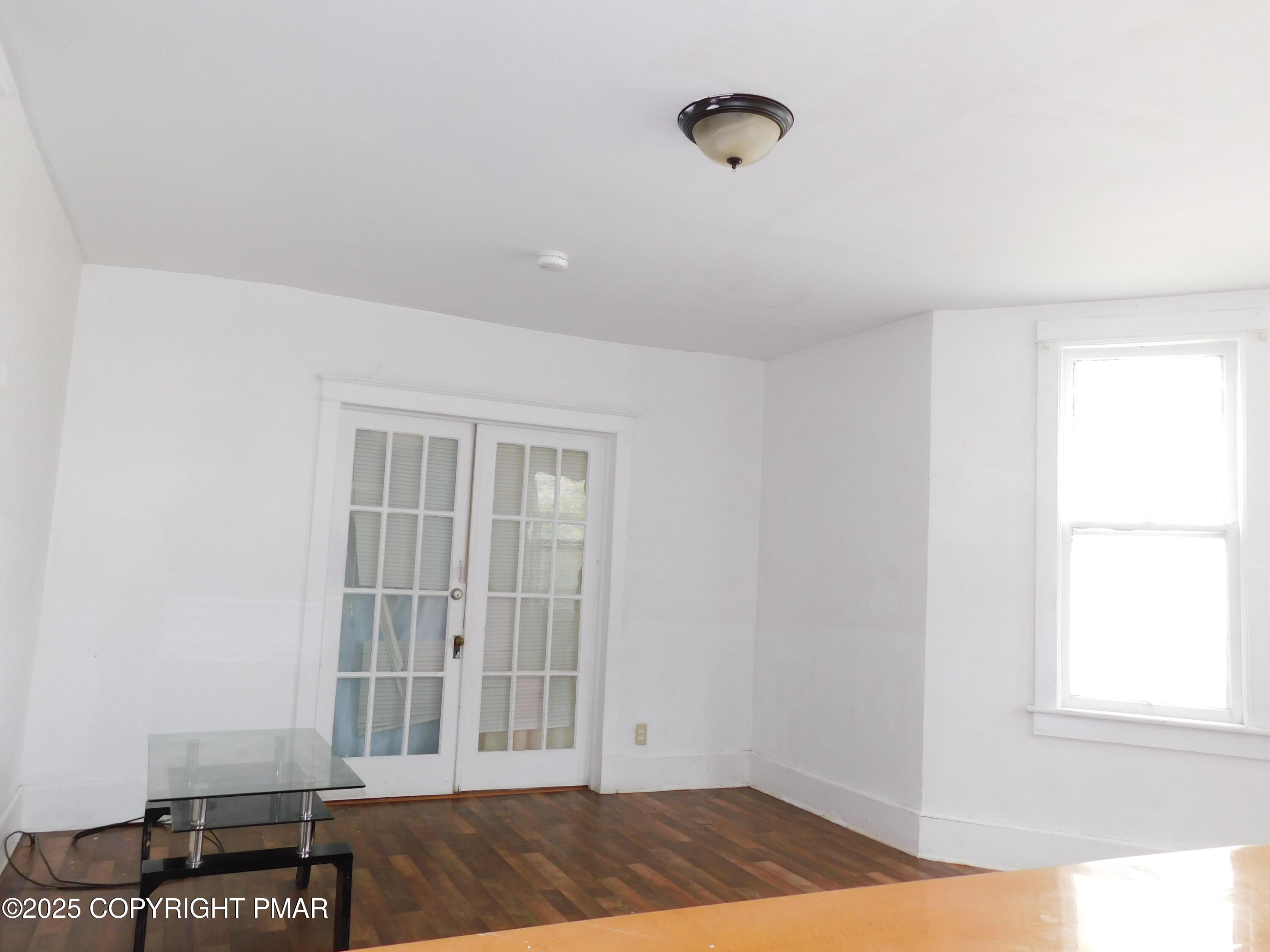 112 Ridgeway Street East Stroudsburg, PA 18301 - Photo 17 of 39 a view of a livingroom with wooden floor and a window