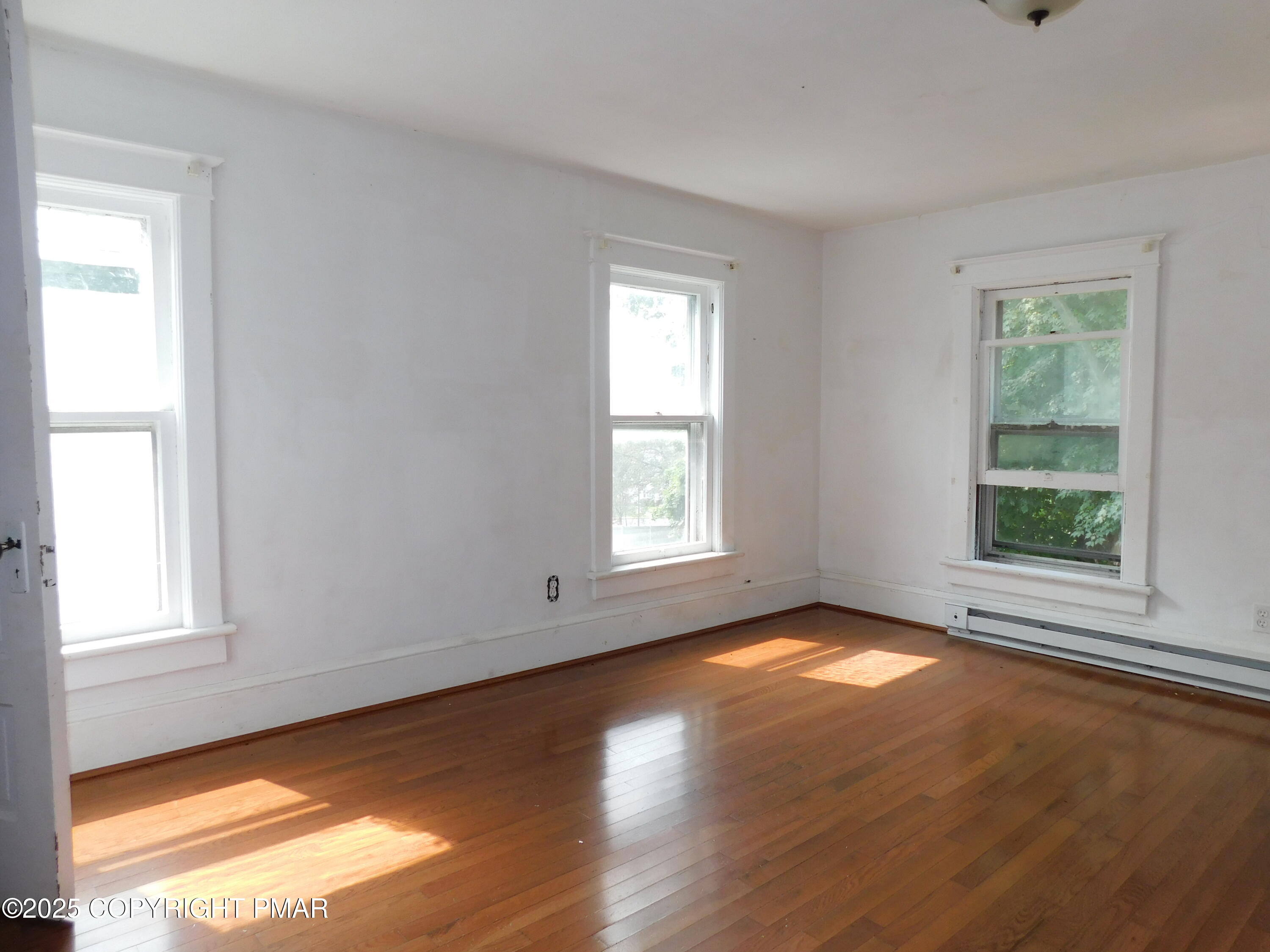 112 Ridgeway Street East Stroudsburg, PA 18301 - Photo 24 of 39 a view of an empty room with wooden floor and a window