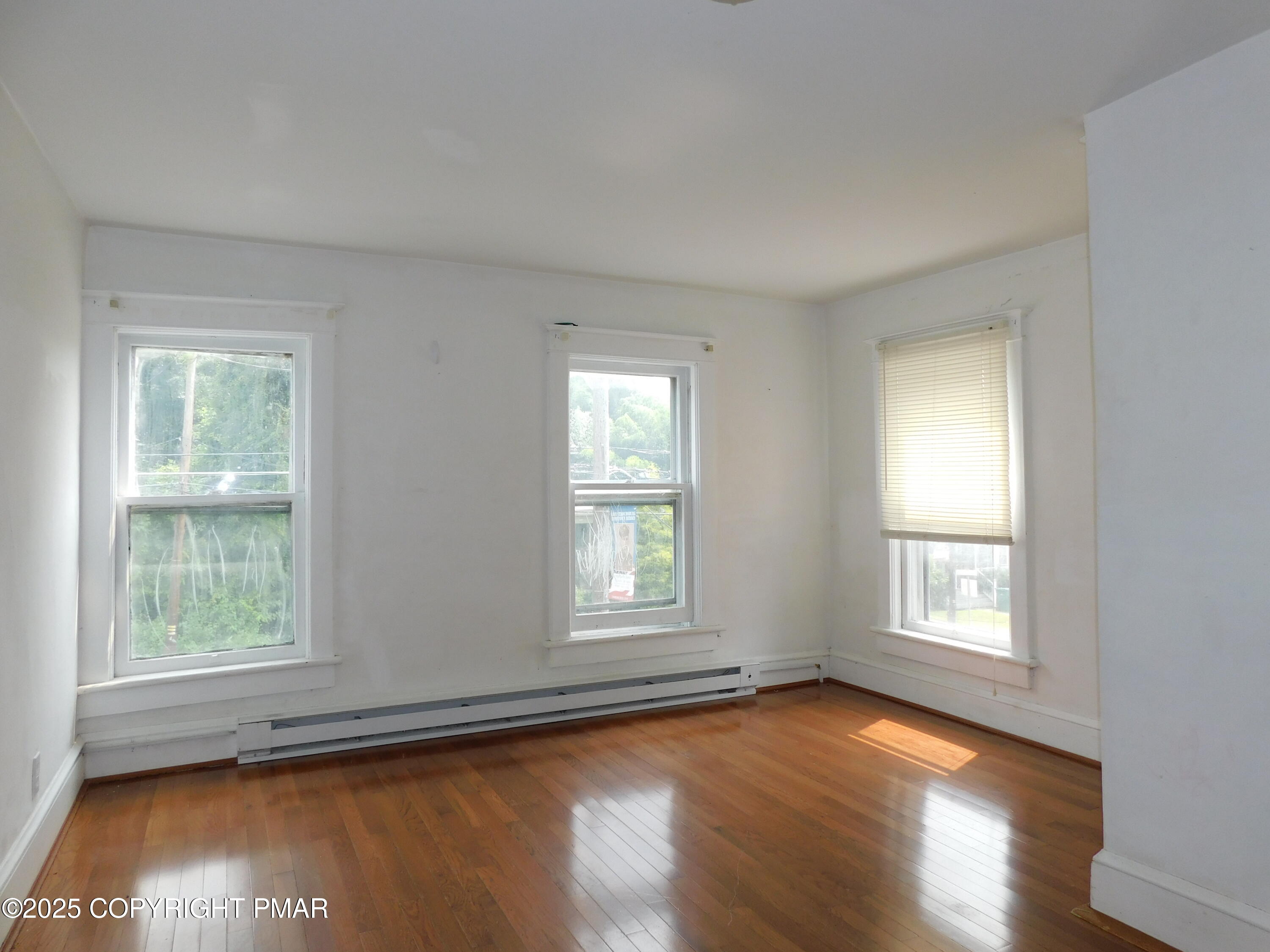 112 Ridgeway Street East Stroudsburg, PA 18301 - Photo 29 of 39 a view of a room with wooden floor and window