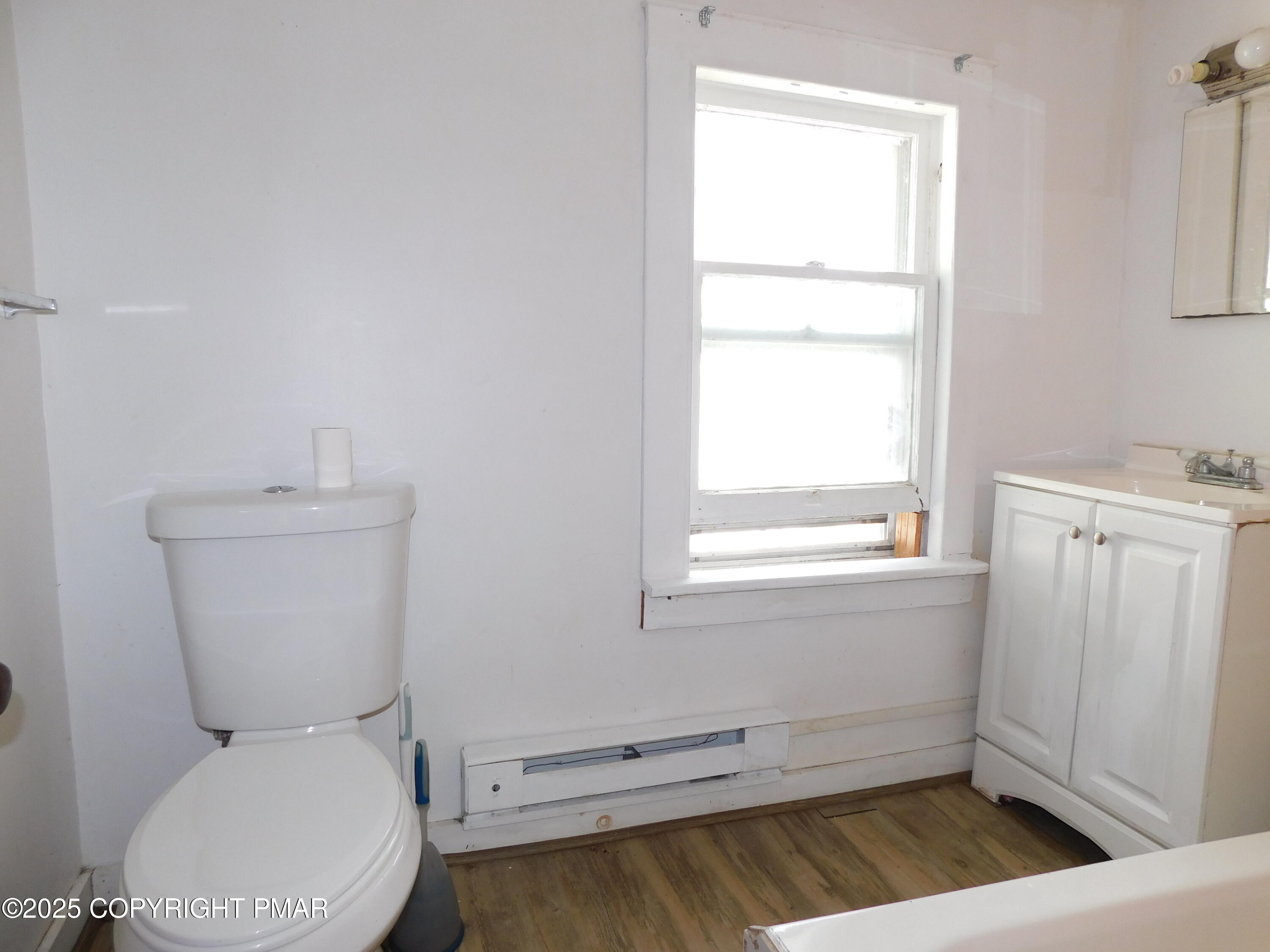 112 Ridgeway Street East Stroudsburg, PA 18301 - Photo 35 of 39 a bathroom with a toilet and a window