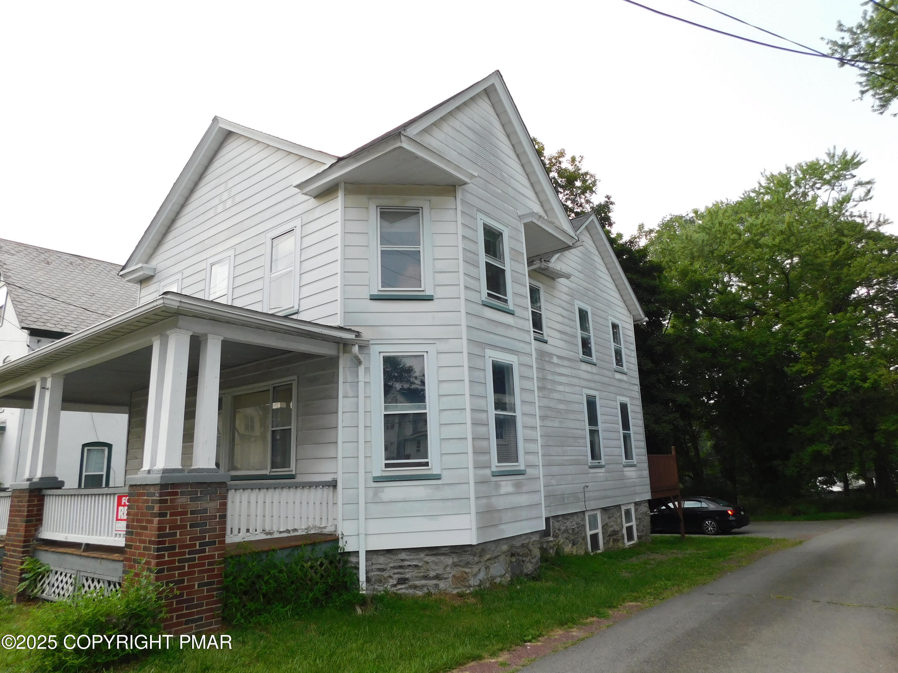 112 Ridgeway Street East Stroudsburg, PA 18301 - Photo 4 of 39 a front view of a house with a yard