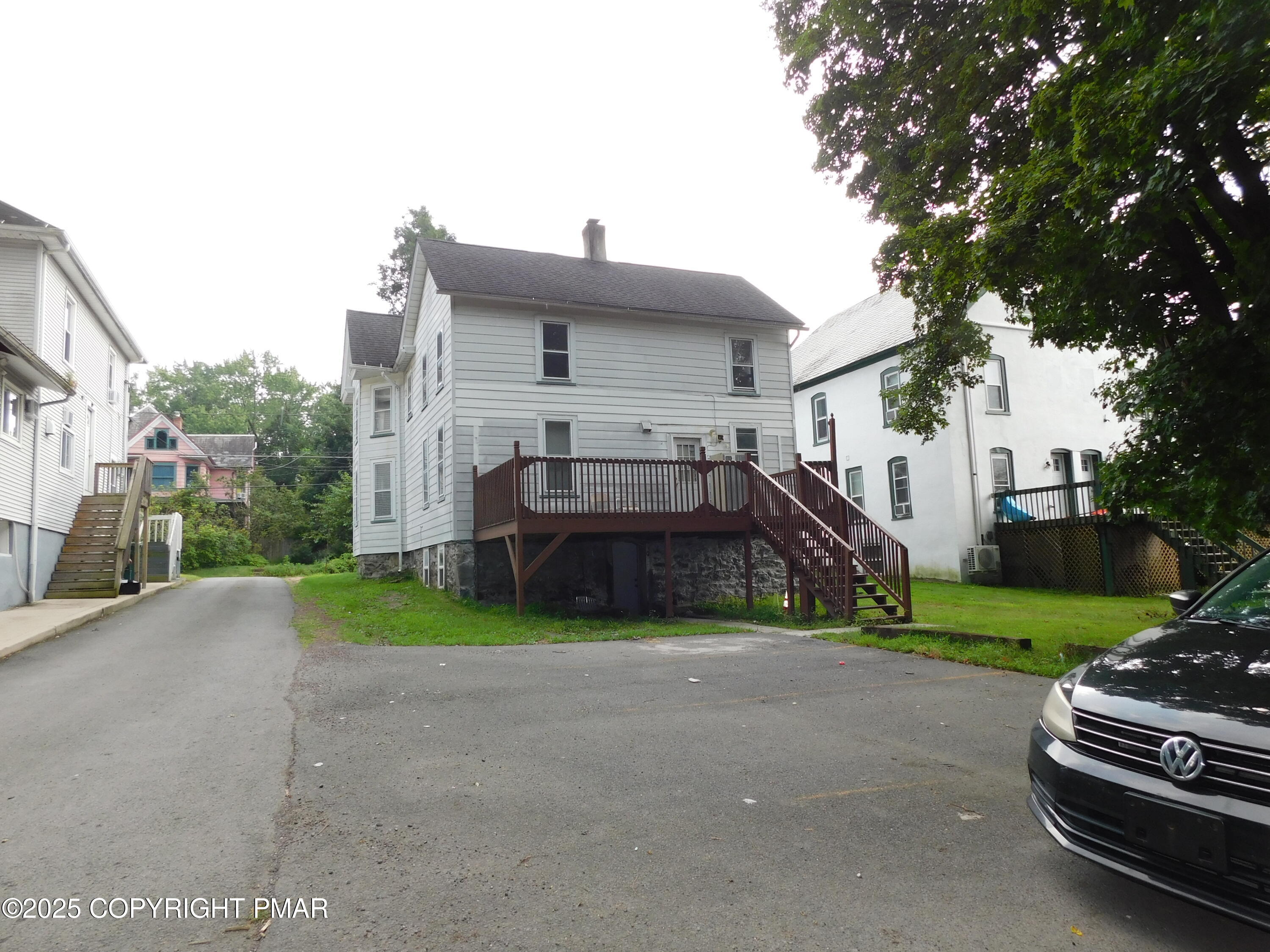 112 Ridgeway Street East Stroudsburg, PA 18301 - Photo 6 of 39 a view of a house with a yard and large tree