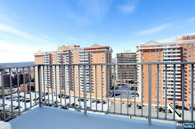 a view of a balcony with chairs