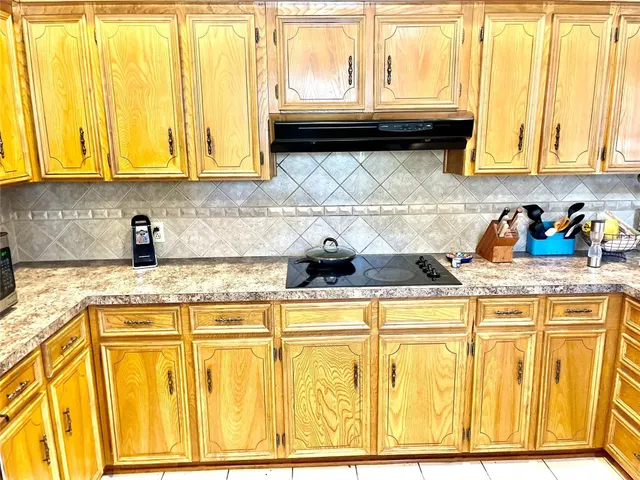 a kitchen with stainless steel appliances granite countertop a sink and cabinets