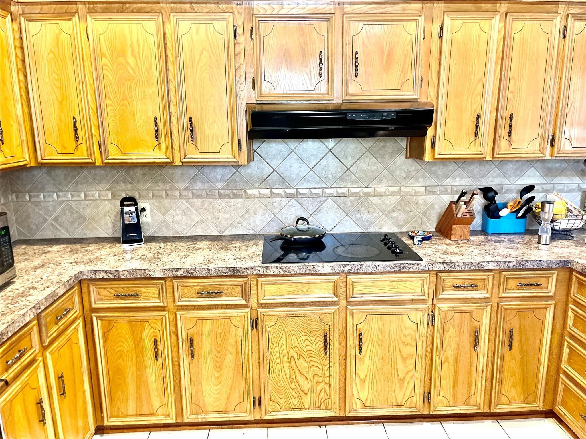 710 South Main Street Coolidge, TX 76635 - Photo 14 of 36 a kitchen with stainless steel appliances granite countertop a sink and cabinets