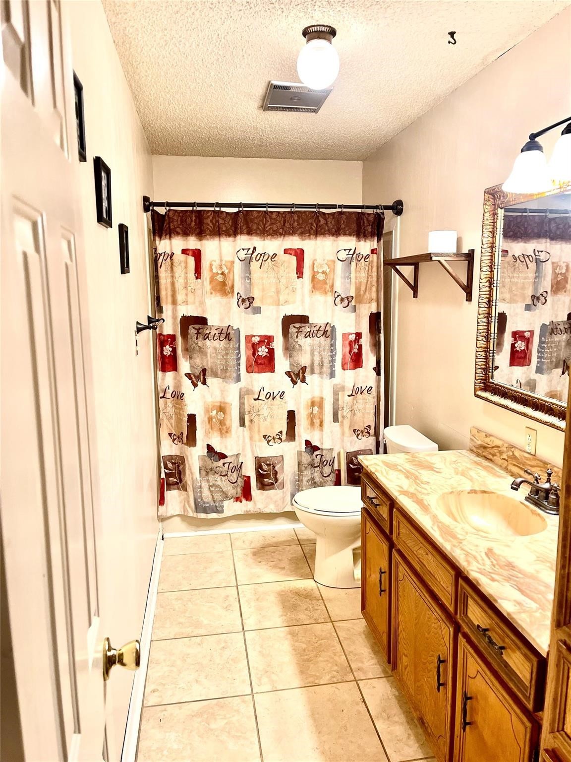 710 South Main Street Coolidge, TX 76635 - Photo 24 of 36 a bathroom with a sink mirror vanity and bathtub