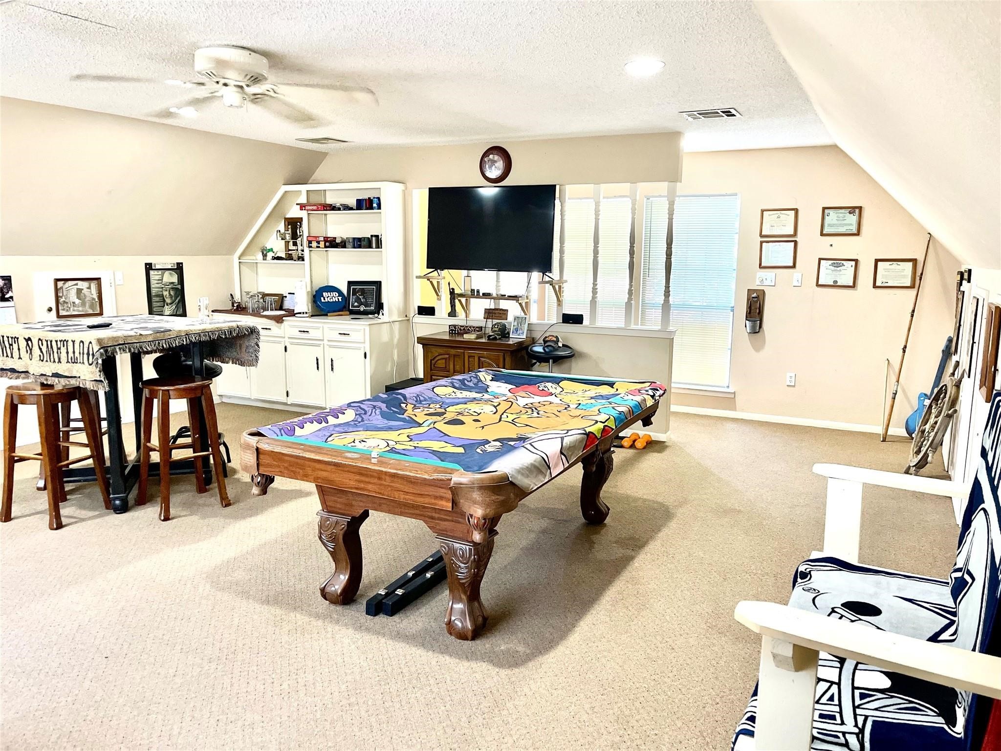710 South Main Street Coolidge, TX 76635 - Photo 9 of 36 a living room with dining table and a flat screen tv
