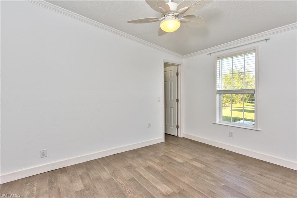 777 Walkerbilt Road, Unit 27 Naples, FL 34110 - Photo 11 of 31 an empty room with windows