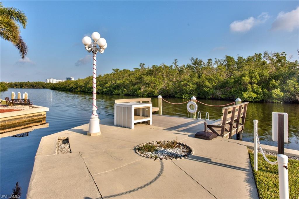 777 Walkerbilt Road, Unit 27 Naples, FL 34110 - Photo 8 of 31 a view of a house with backyard
