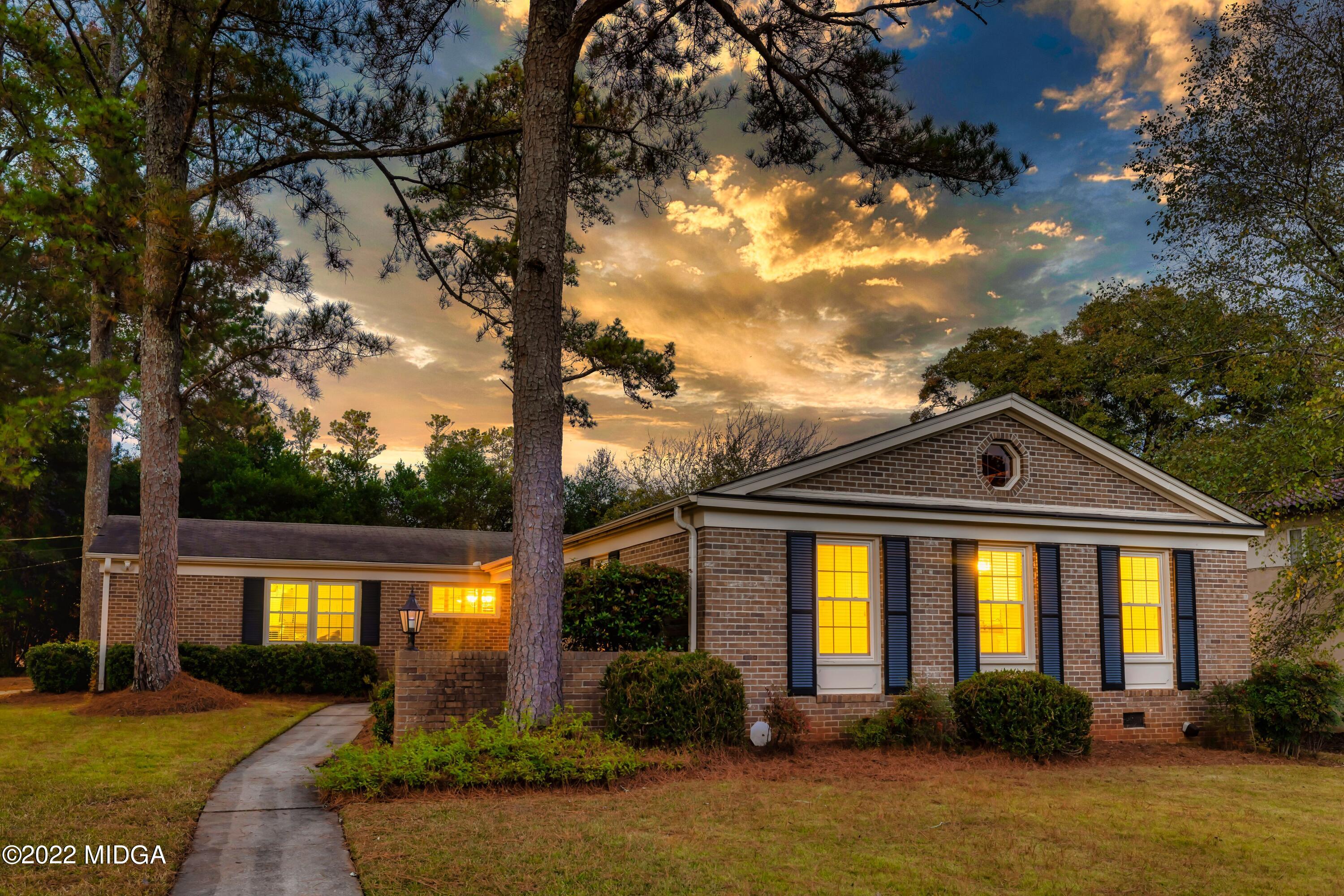 201 Larcom Lane Griffin, GA 30224 - Photo 1 of 64 a front view of a house with a yard