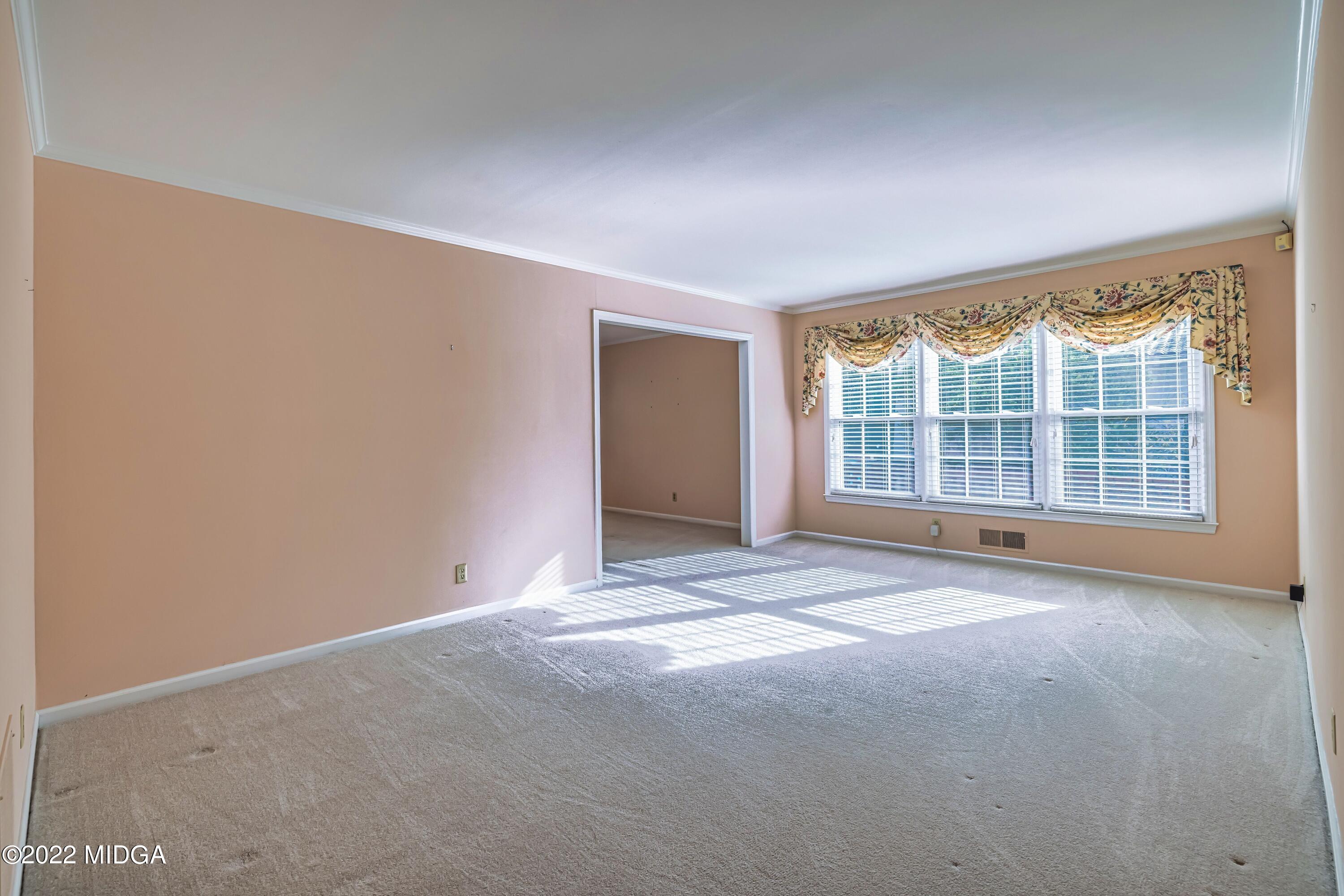 201 Larcom Lane Griffin, GA 30224 - Photo 14 of 64 a view of an empty room with a window