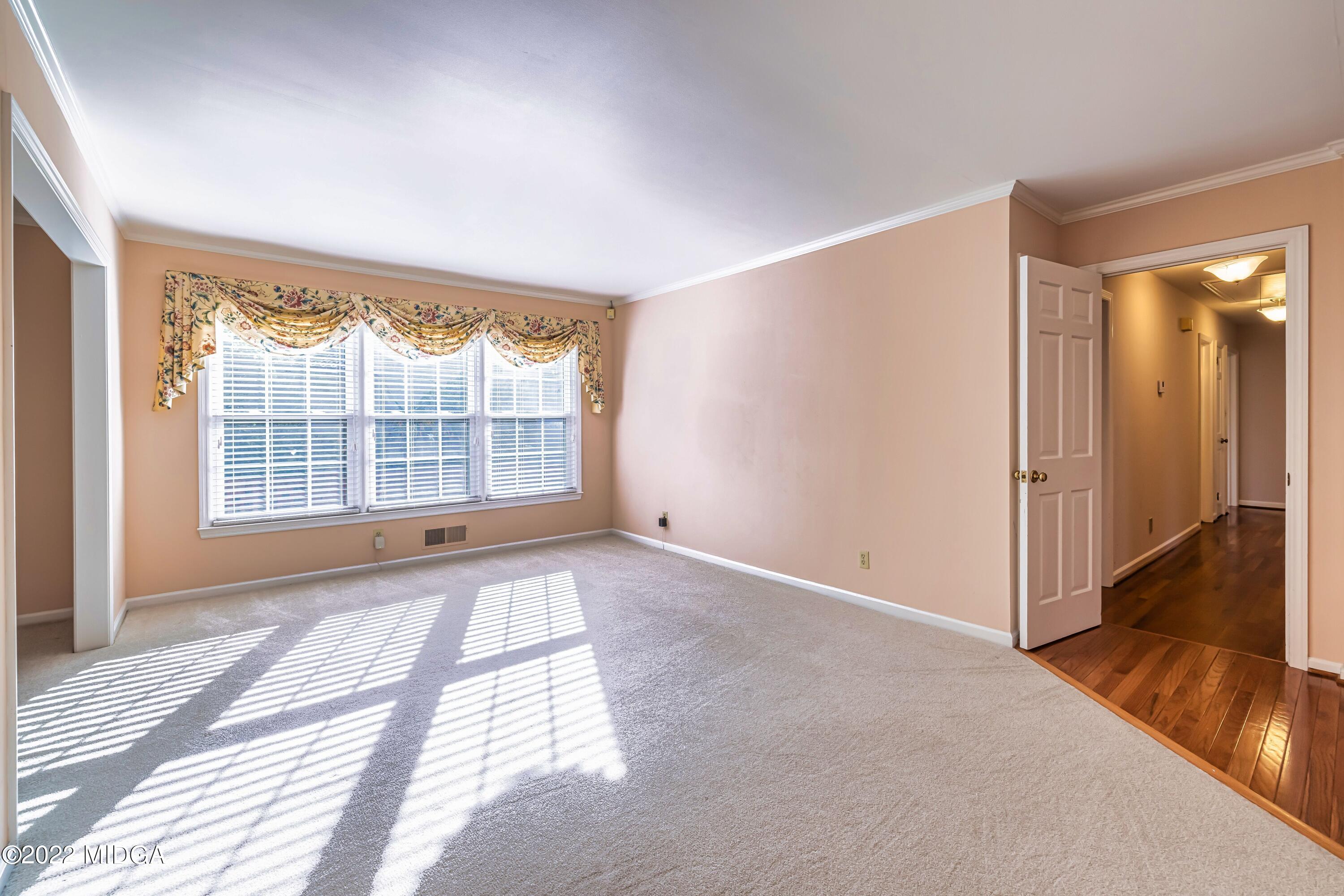 201 Larcom Lane Griffin, GA 30224 - Photo 15 of 64 a view of an empty room with a window