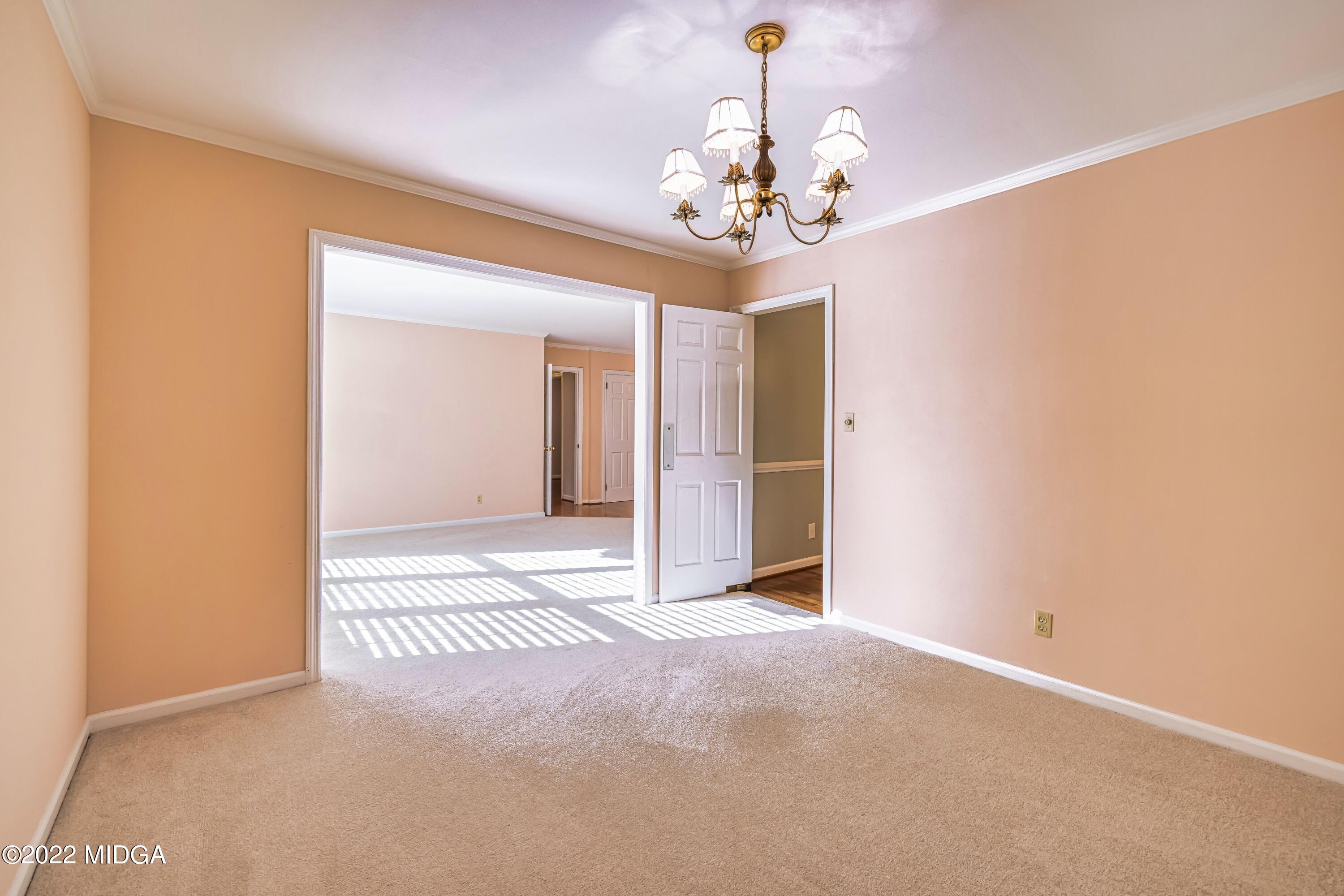 201 Larcom Lane Griffin, GA 30224 - Photo 18 of 64 a view of a chandelier in a room