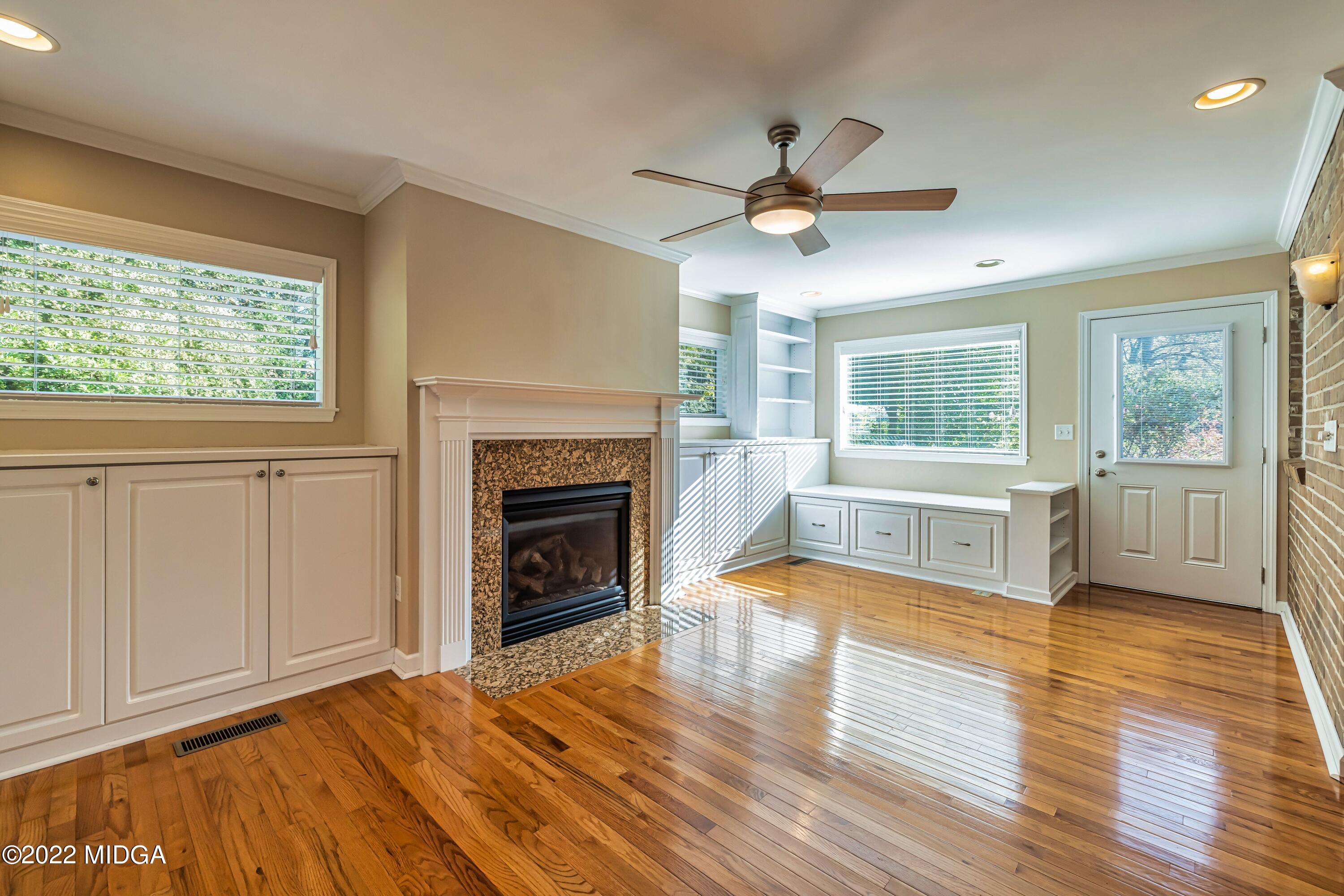 201 Larcom Lane Griffin, GA 30224 - Photo 25 of 64 a view of a livingroom with wooden floor and a fireplace
