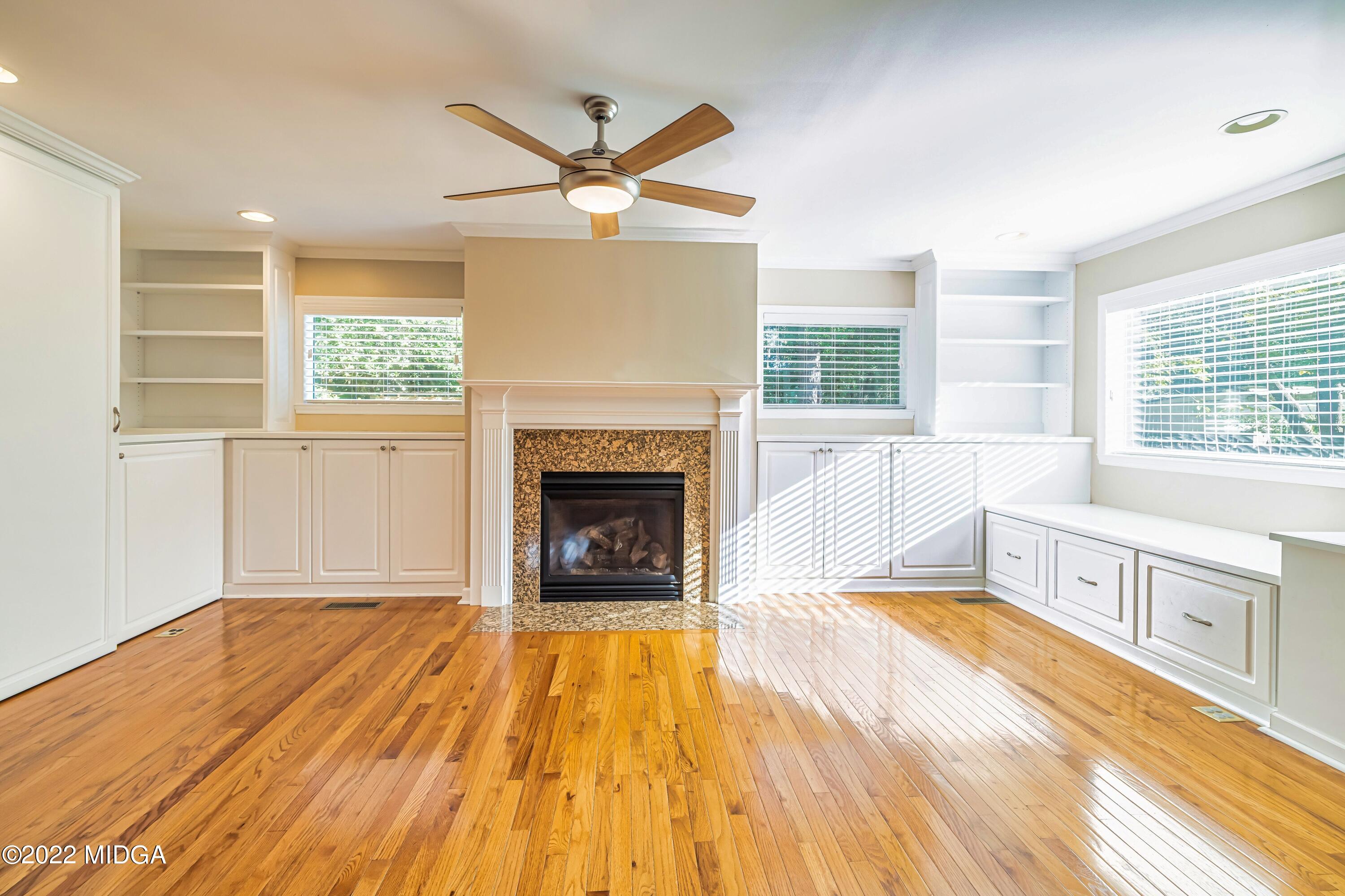 201 Larcom Lane Griffin, GA 30224 - Photo 27 of 64 a spacious bedroom with a bed and a fireplace