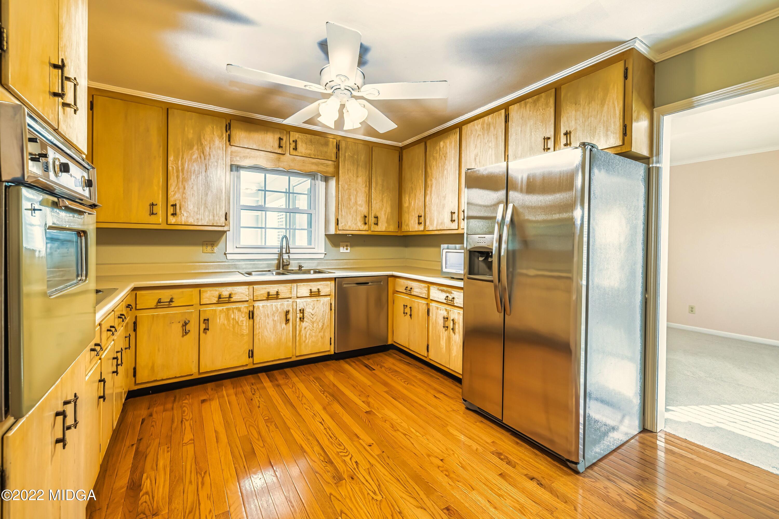 201 Larcom Lane Griffin, GA 30224 - Photo 30 of 64 a kitchen with cabinets a sink and appliances