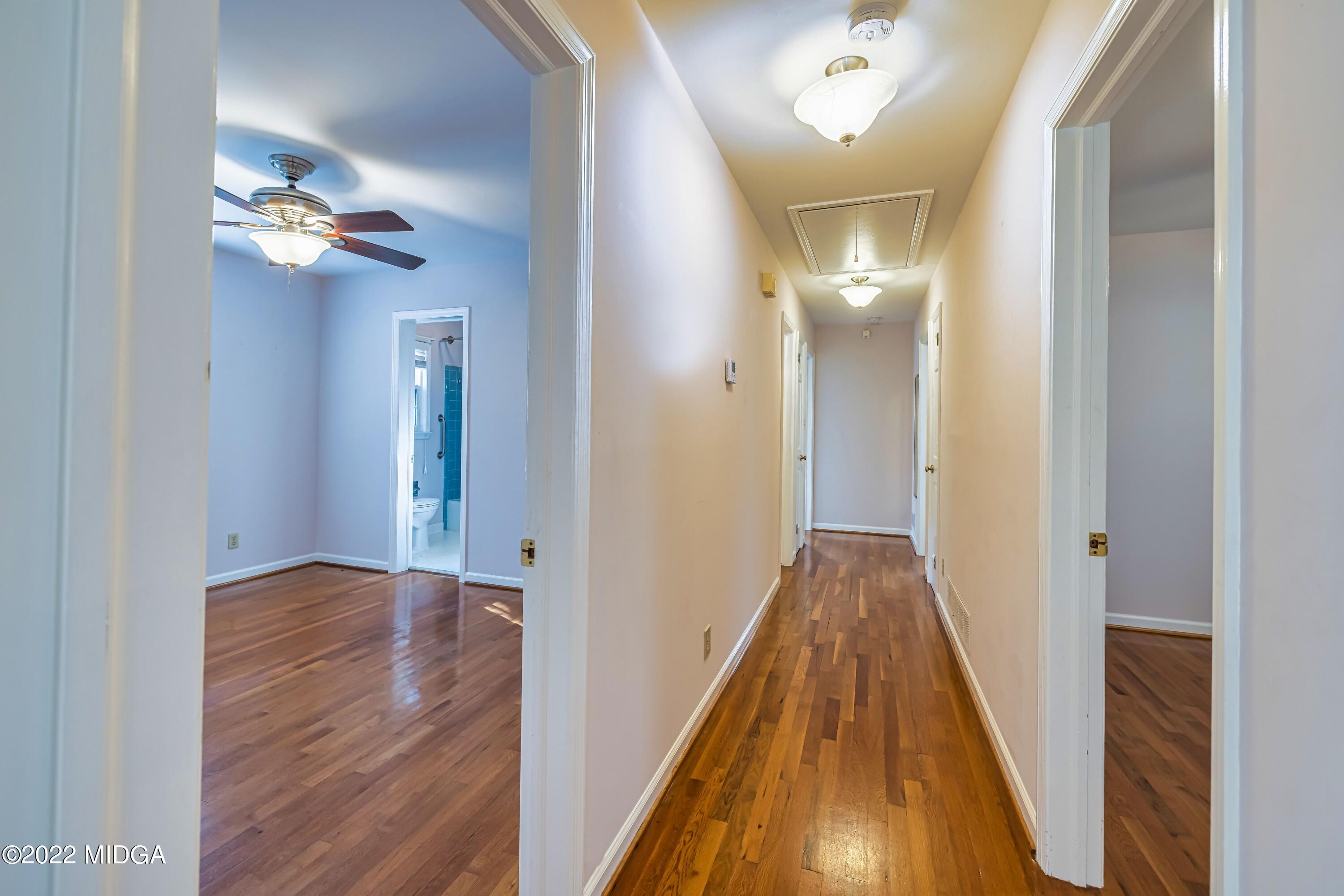 201 Larcom Lane Griffin, GA 30224 - Photo 32 of 64 a view of a hallway with wooden floor and staircase
