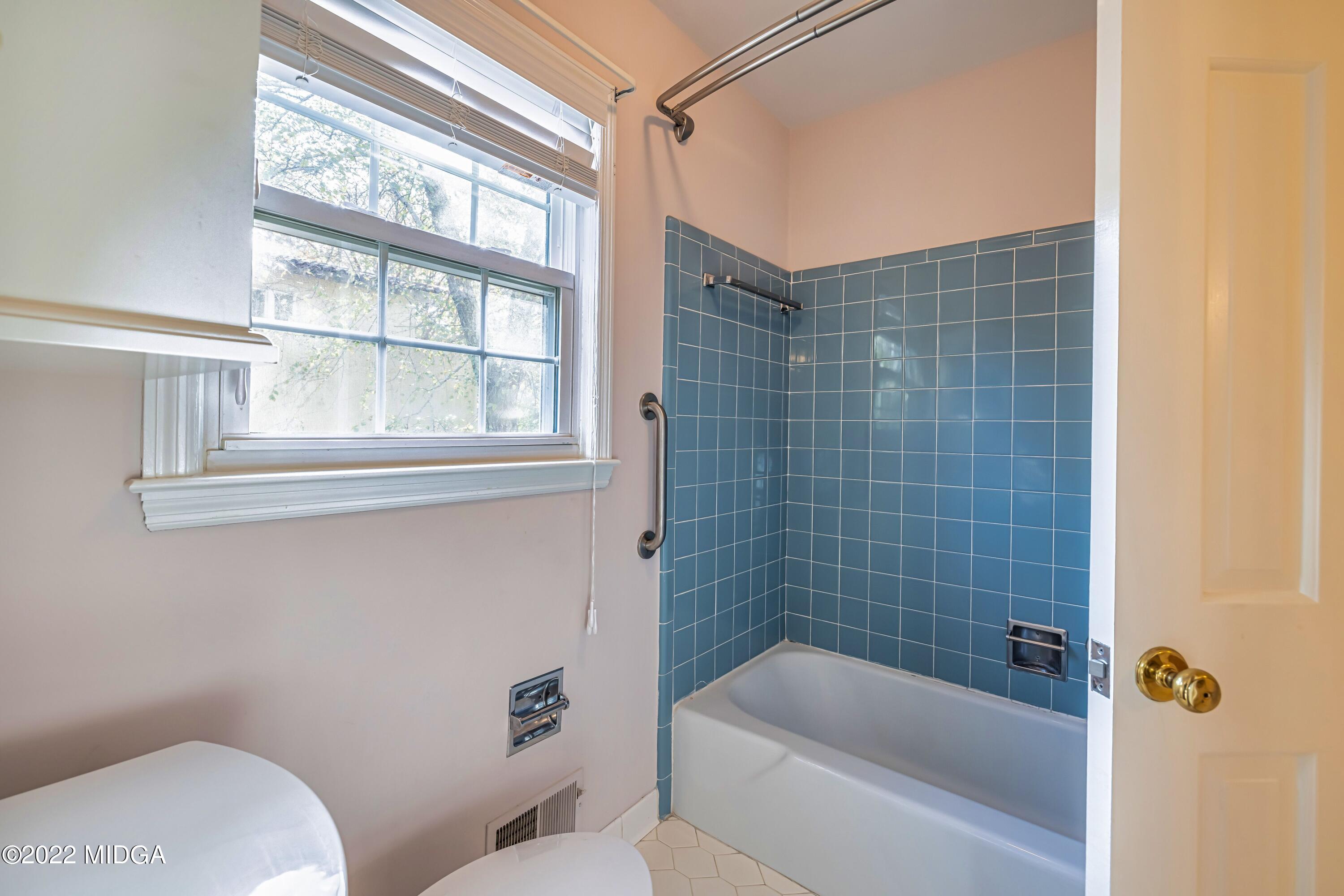 201 Larcom Lane Griffin, GA 30224 - Photo 35 of 64 a bathroom with a toilet and shower