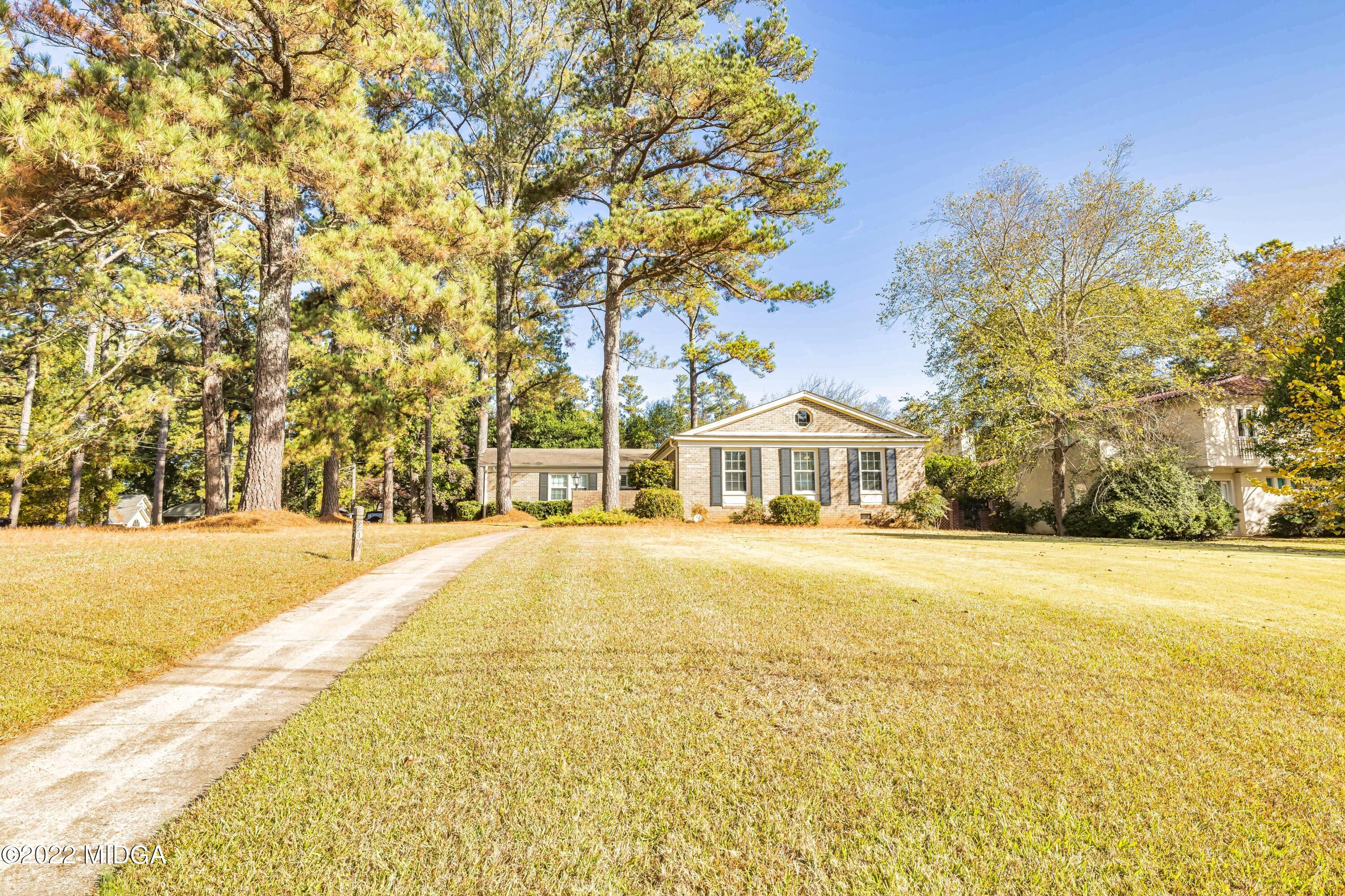 201 Larcom Lane Griffin, GA 30224 - Photo 4 of 64 a front view of a house with a yard