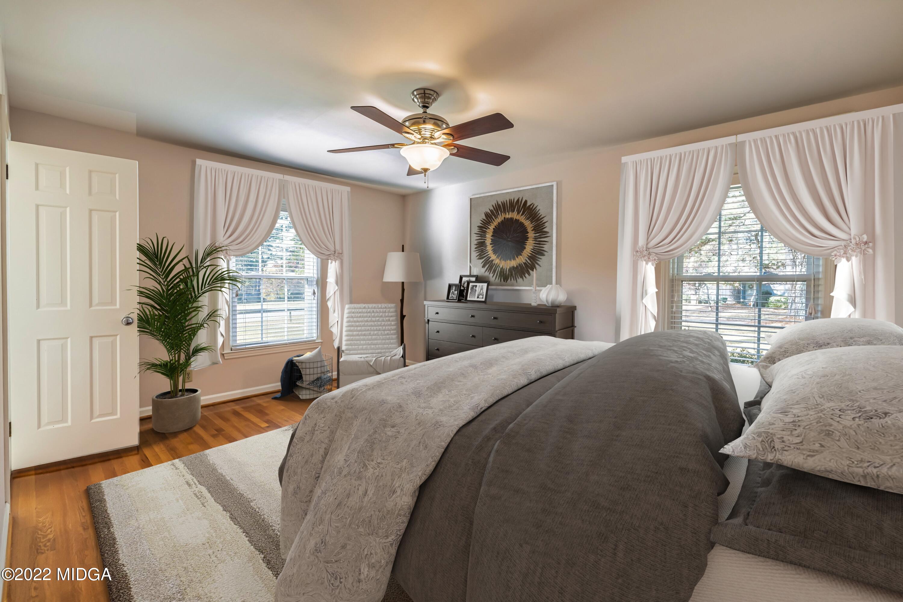 201 Larcom Lane Griffin, GA 30224 - Photo 41 of 64 a living room with a bed furniture and a large window