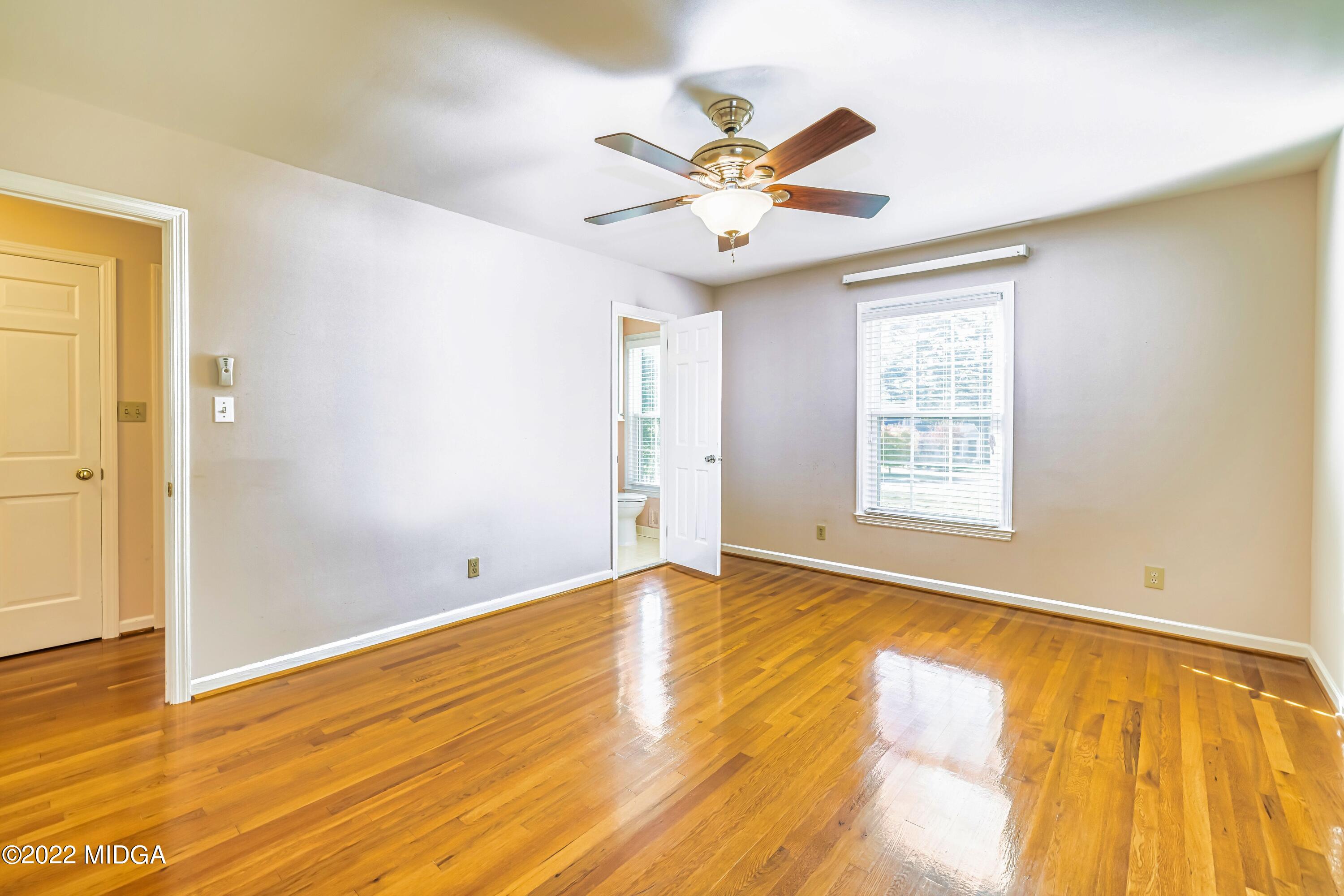 201 Larcom Lane Griffin, GA 30224 - Photo 42 of 64 wooden floor in an empty room with a window