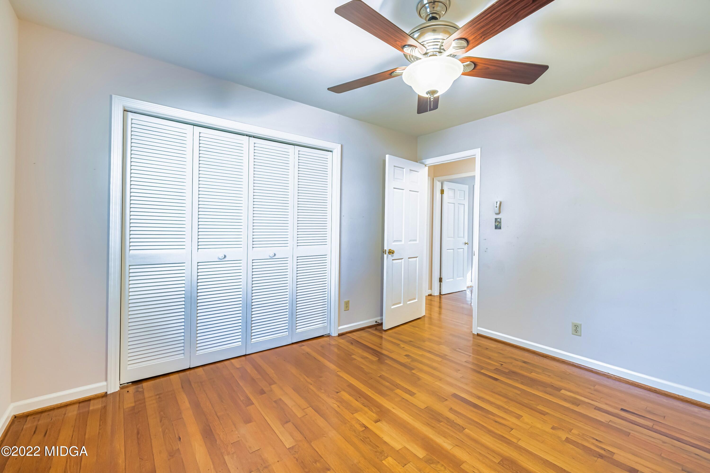 201 Larcom Lane Griffin, GA 30224 - Photo 46 of 64 wooden floor in an empty room with a window