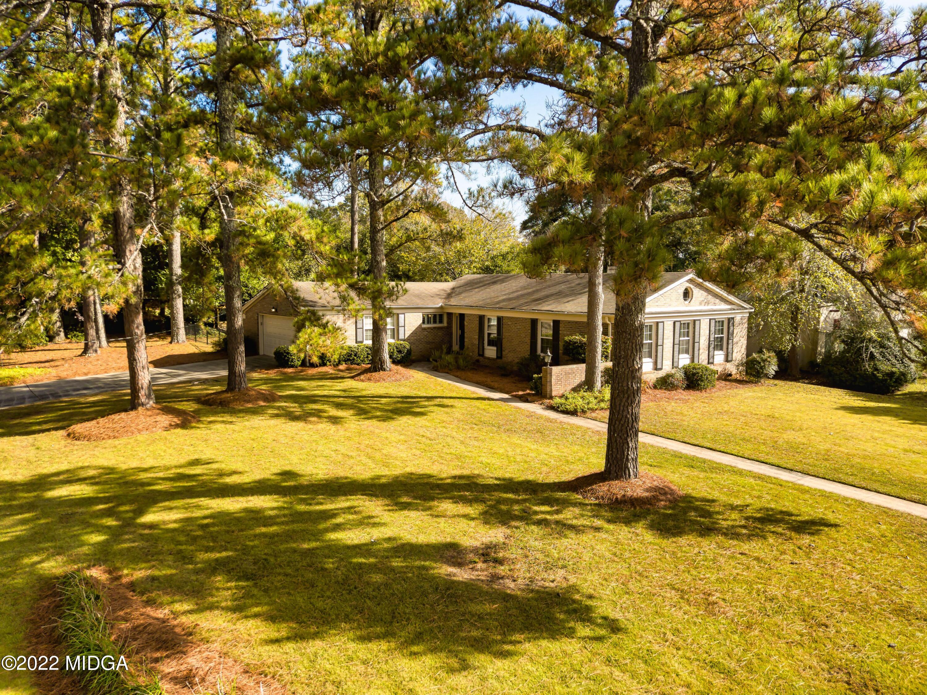 201 Larcom Lane Griffin, GA 30224 - Photo 53 of 64 a house with swimming pool in front of it
